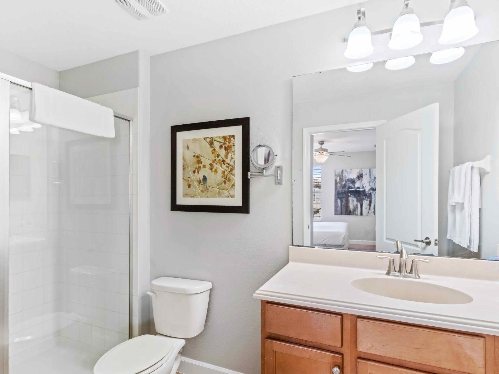 The toilet and bath create a private oasis for guests to refresh and rejuvenate. With modern fixtures, a soothing ambiance, and thoughtful design, it provides a comfortable space for personal care and relaxation.