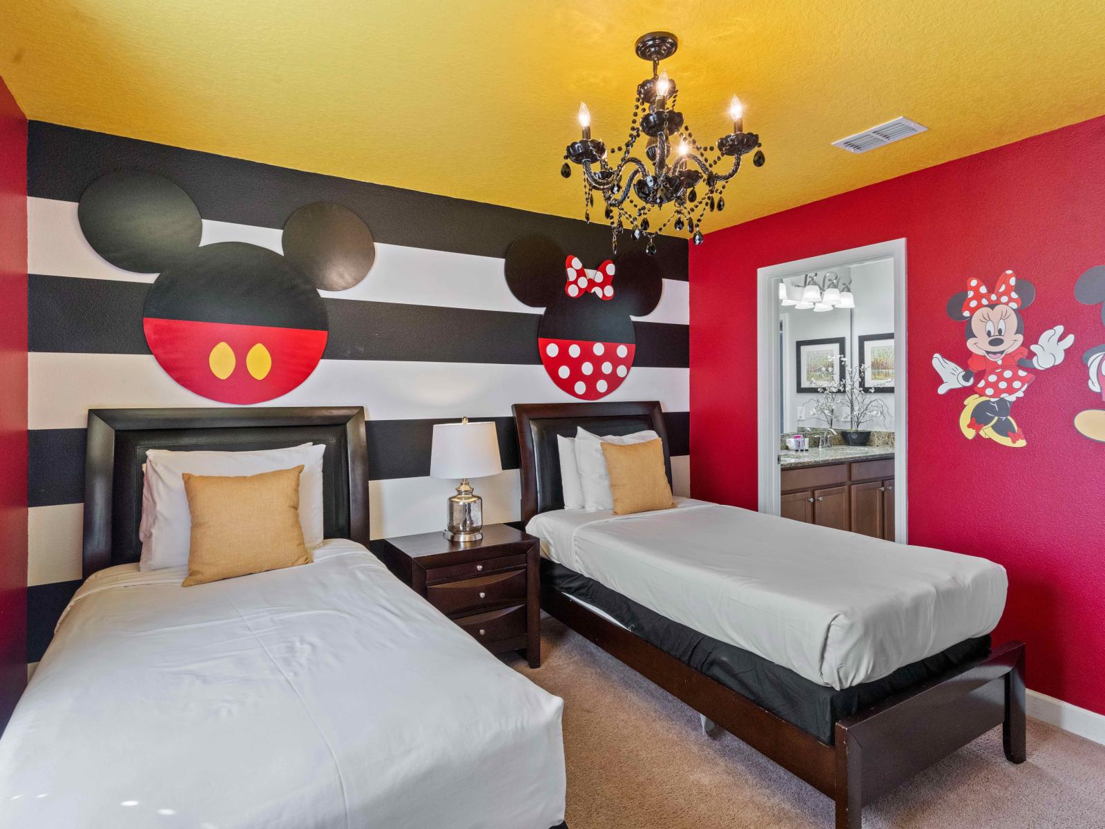 The Mickey and Minnie Mouse themed bedroom is a whimsical retreat inspired by Disney's iconic characters. With playful decor, vibrant colors and charming accents,