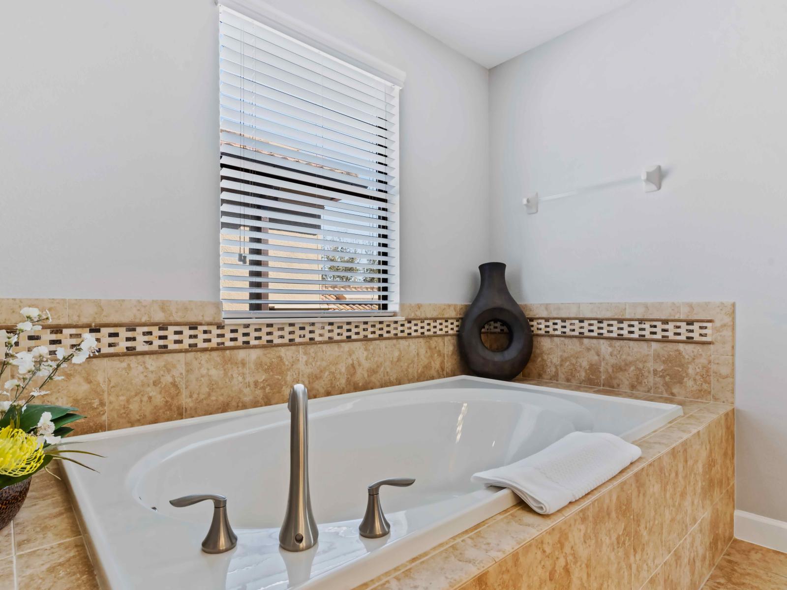 The bathtub  is a serene bathing haven designed for ultimate relaxation.