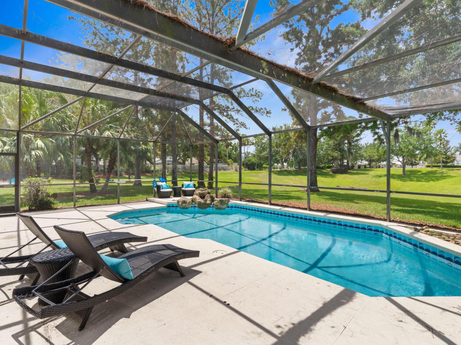 Splendid Shared Pool of the Apartment in Kissimmee - Cosy beach chairs available - Dive into refreshing poolside escape - Immerse yourself in the cool elegance of our pool - Experience ultimate relaxation in our poolside paradise