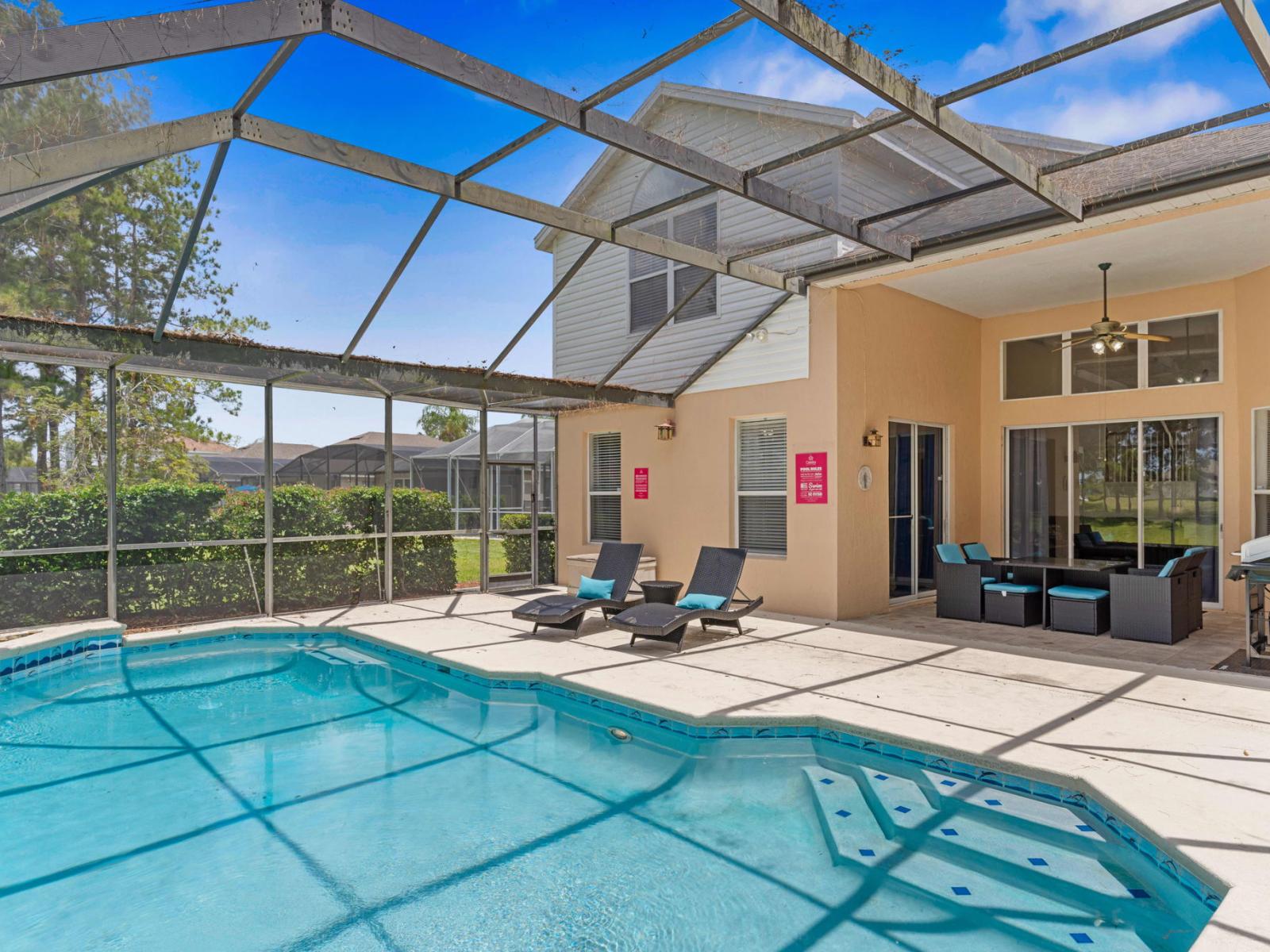 Splendid Shared Pool of the Apartment in Kissimmee - Cosy beach chairs available - Dive into refreshing poolside escape - Immerse yourself in the cool elegance of our pool - Experience ultimate relaxation in our poolside paradise