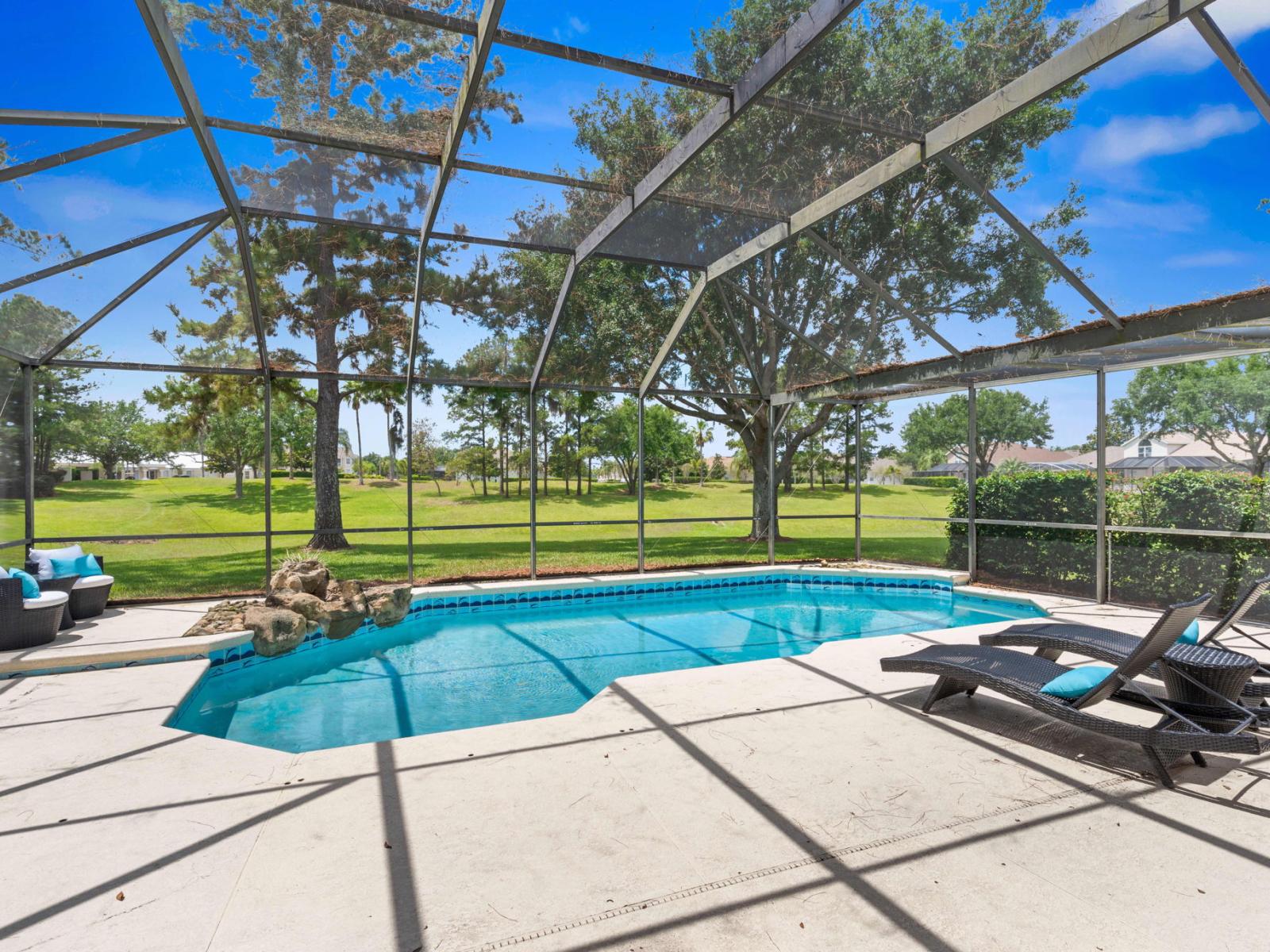 Mesmerizing Shared Pool of the Apartment in Kissimmee - Cosy beach chairs available - Dive into refreshing poolside escape - Immerse yourself in the cool elegance of our pool - Experience ultimate relaxation in our poolside paradise