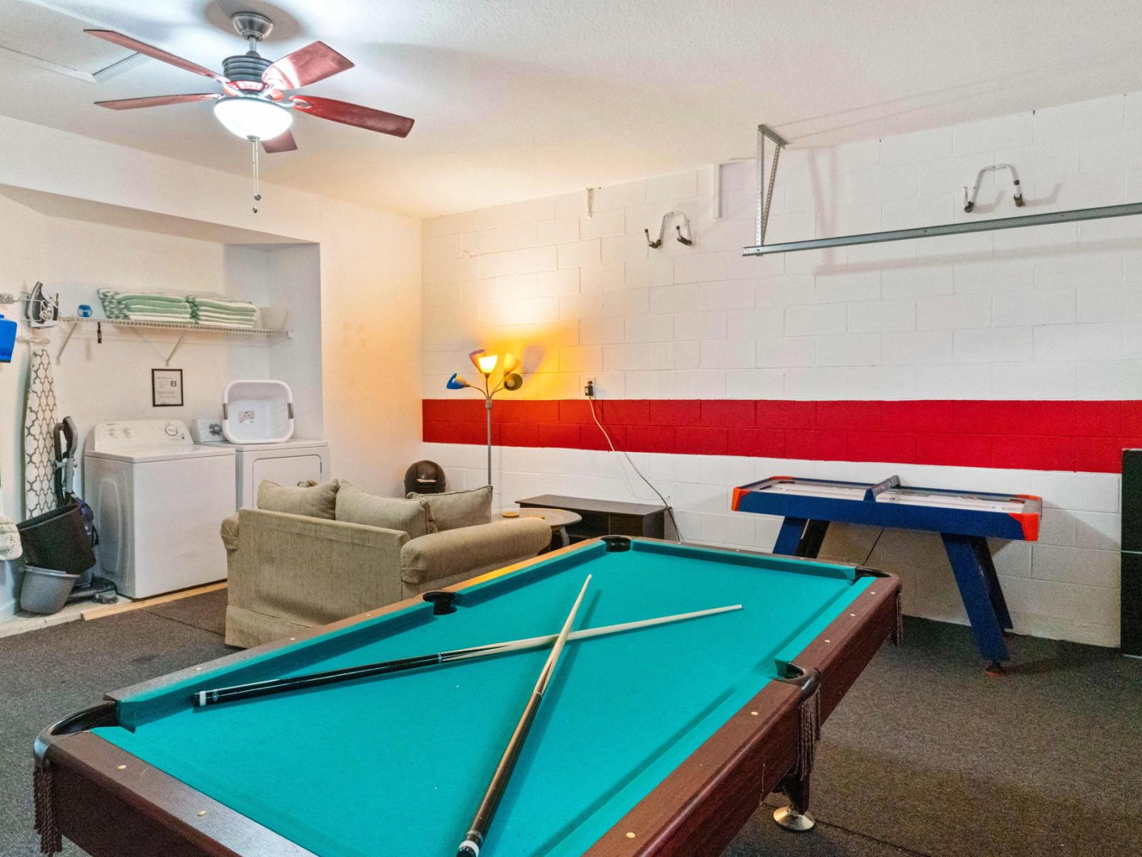 Level up your vacation experience at apartments Game Room fun for all ages! - From classic arcade games to modern consoles, our game room of apartment has it all. - Create unforgettable memories with friends in our spacious game room