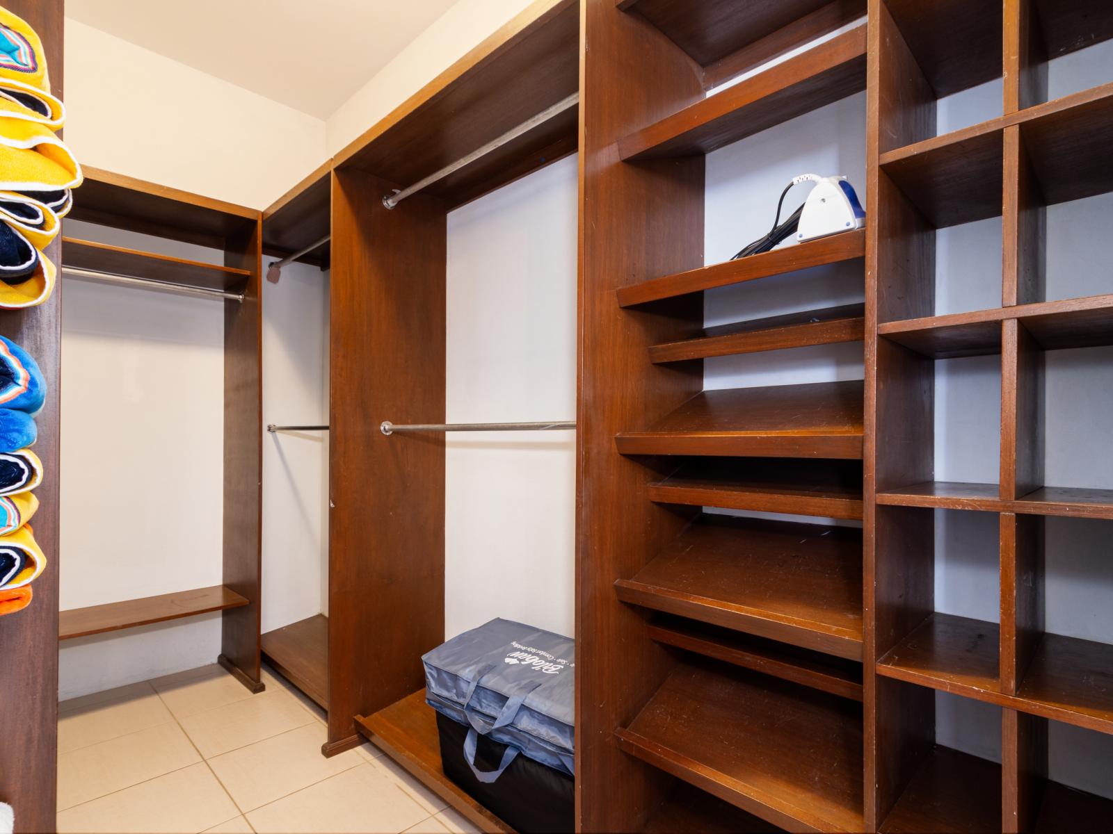 Spacious Walk In Closet of the Apartment in Noord Aruba - Store more of your thing - Custom-built shelving ensures functionality and a clutter-free environment