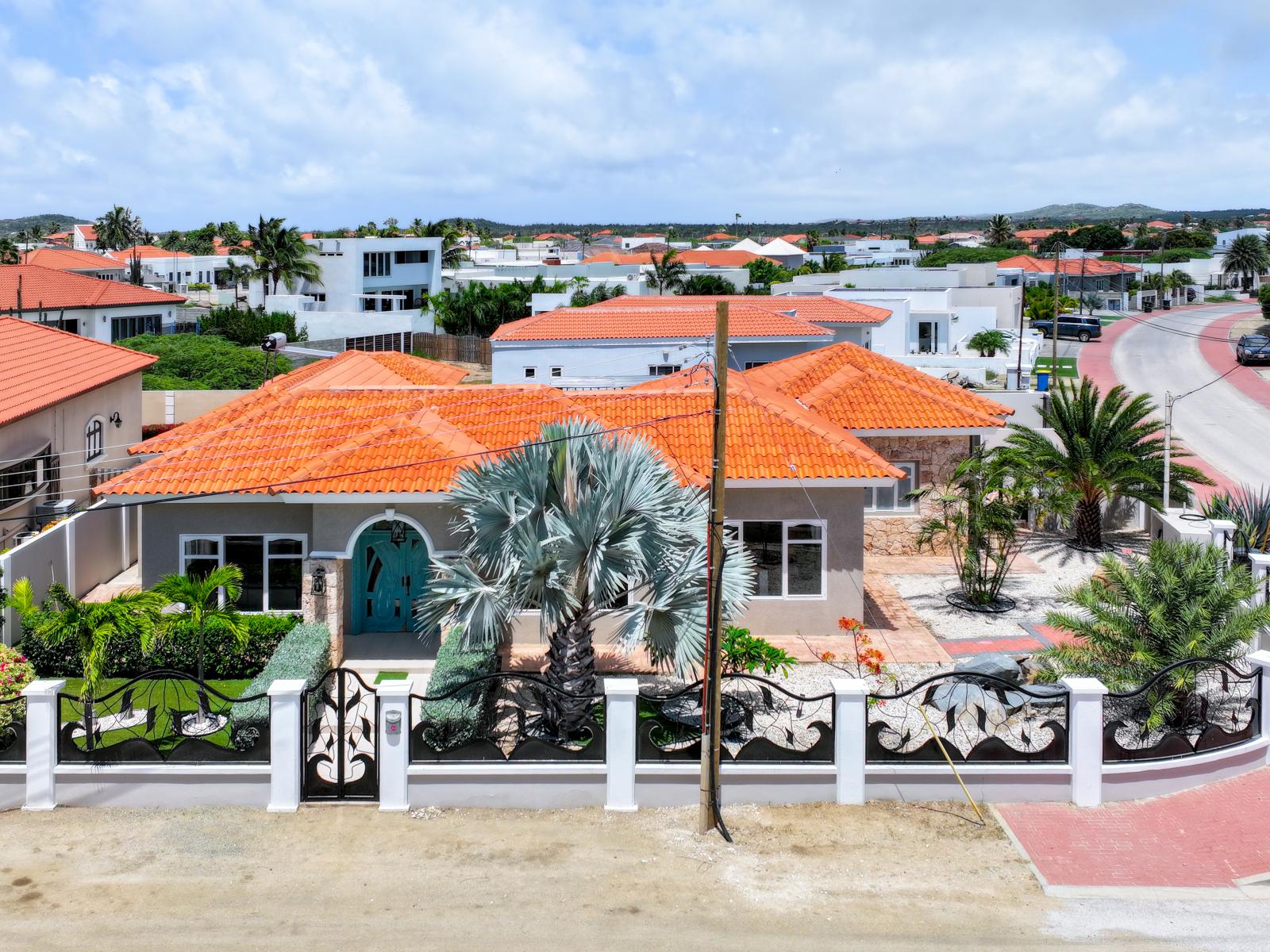 Inviting Home in Noord Aruba - Front View of the Home - Peaceful and quite Neighborhood - Palm trees and tropical plants enhance the vacation feel