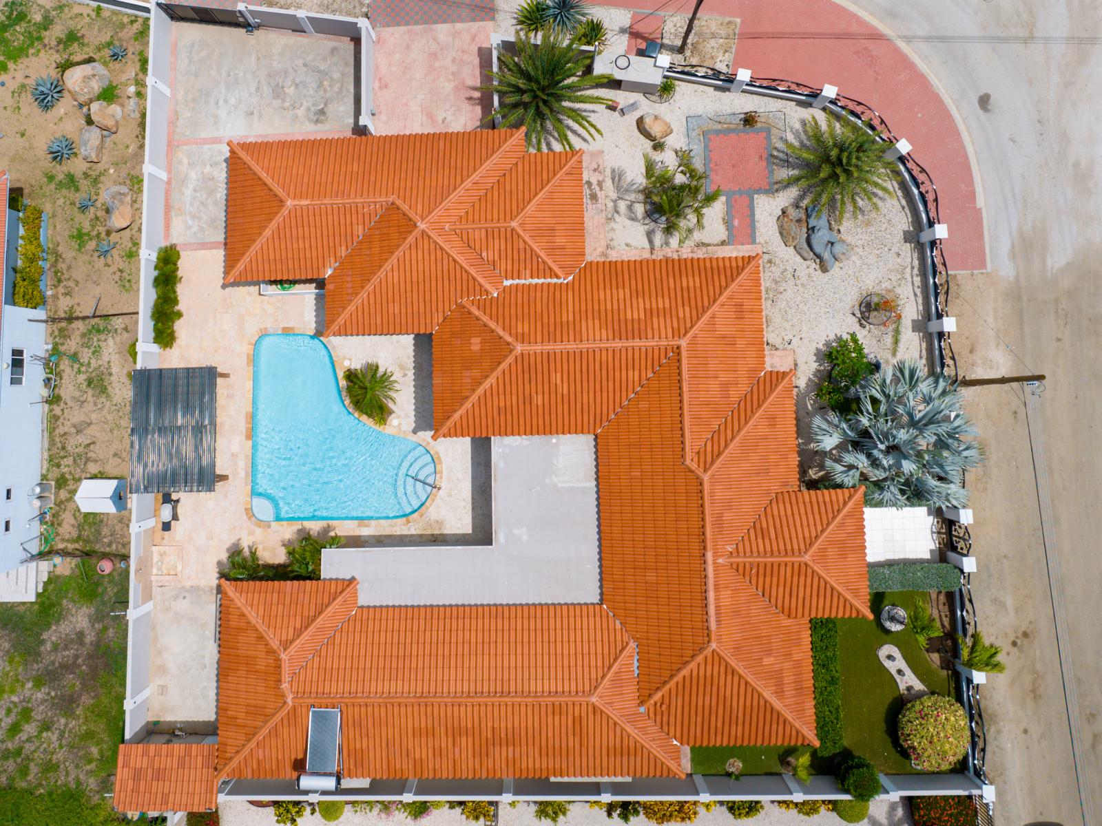 Inviting Home in Noord Aruba - Drone shot of the Home - Esmeralda Neighborhood - Peaceful and quite Neighborhood - Palm trees and tropical plants enhance the vacation feel