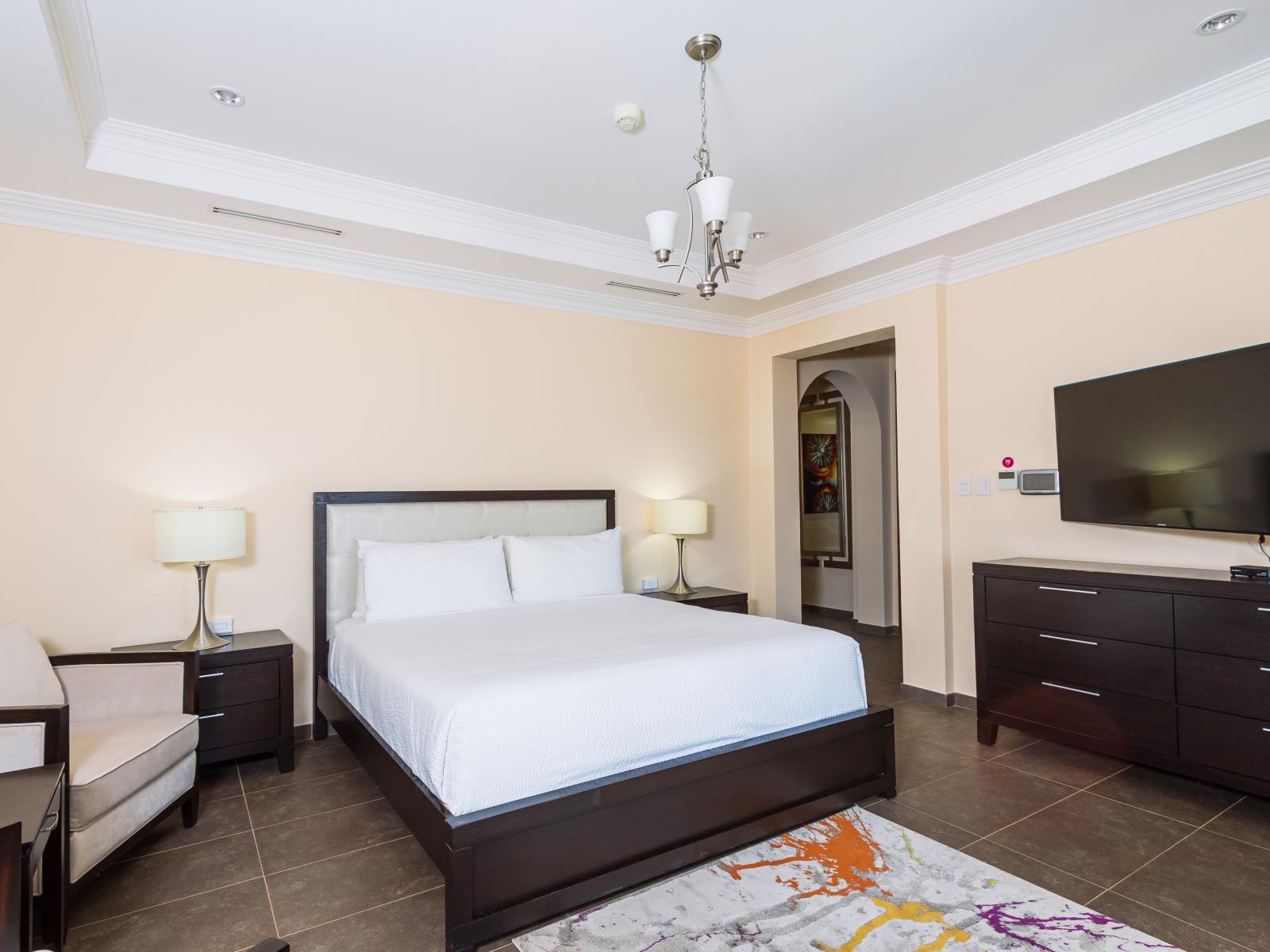 Surrender to luxury in Bedroom 3 with a lavish King size bed, TV for entertainment, and an attached bathroom. From lazy mornings in bed to unwinding with your favorite shows, this elegant retreat promises a tailored stay.