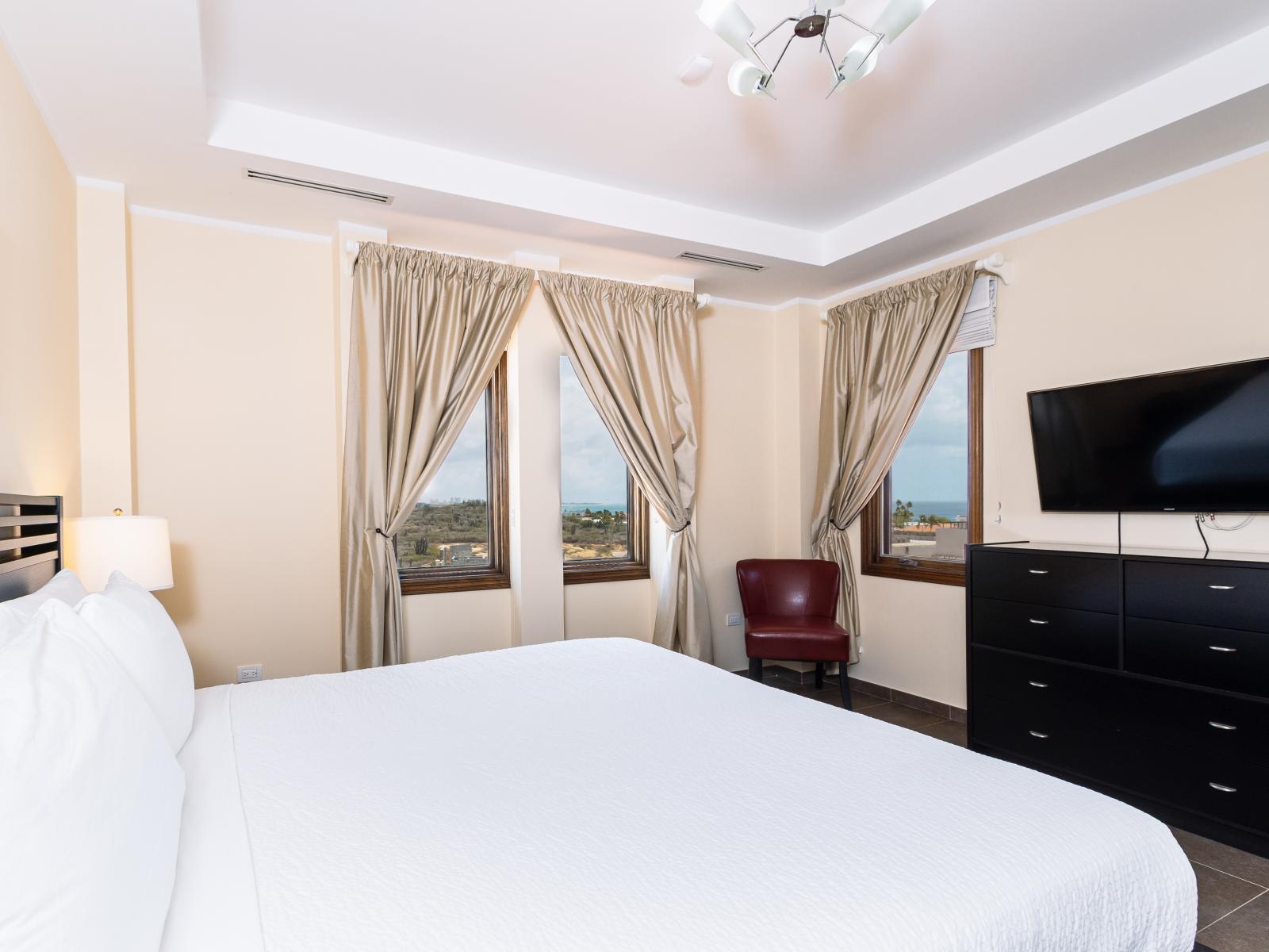 Enjoy comfort in Bedroom 4 with a TV and luxurious attached bathroom, perfect for seamless relaxation.