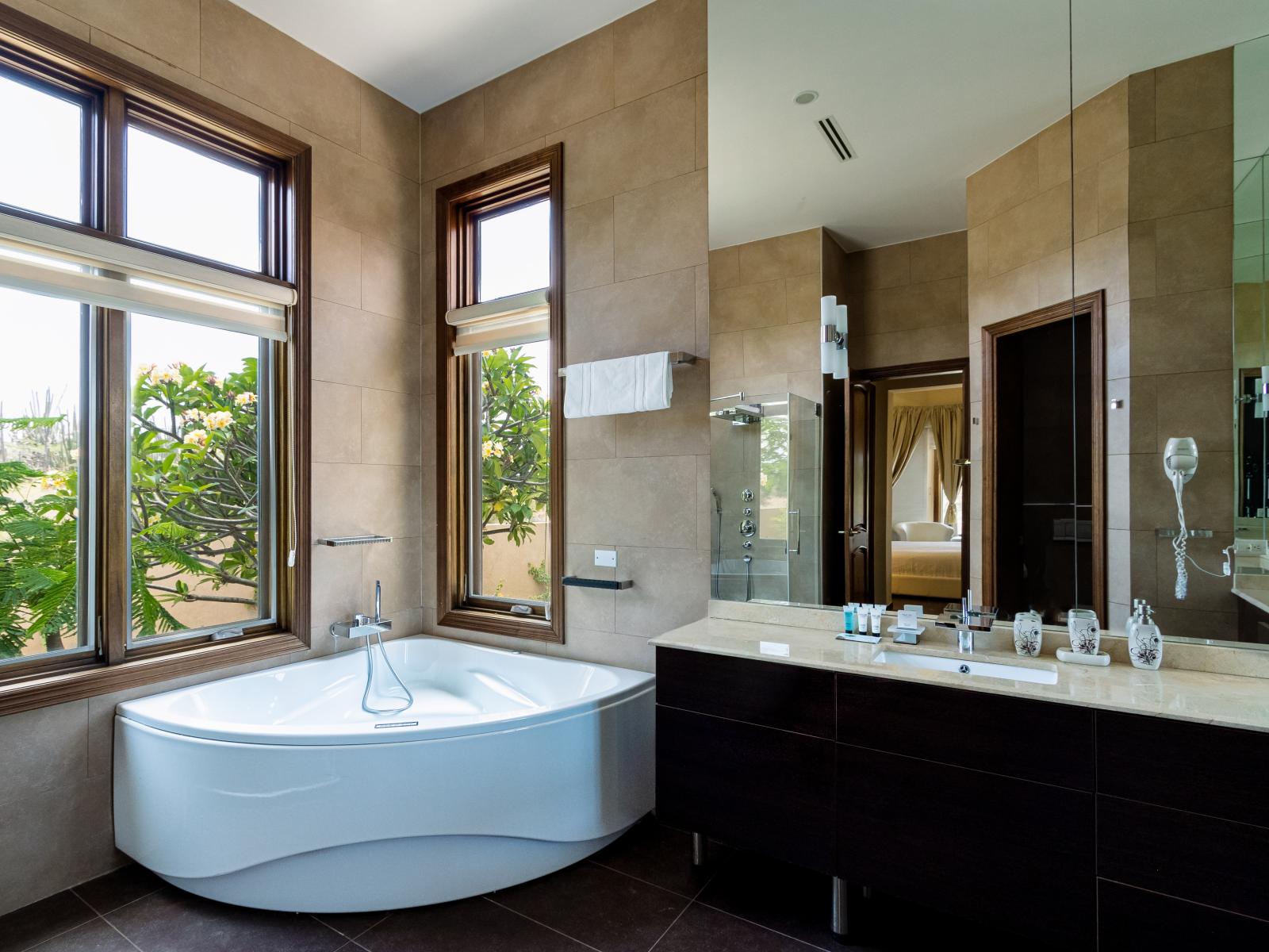 Bathroom 5 - Elevate your daily routine in our modern bathroom, where sleek design meets functionality. From refreshing showers to relaxing baths, this inviting space ensures every moment is a rejuvenating experience.