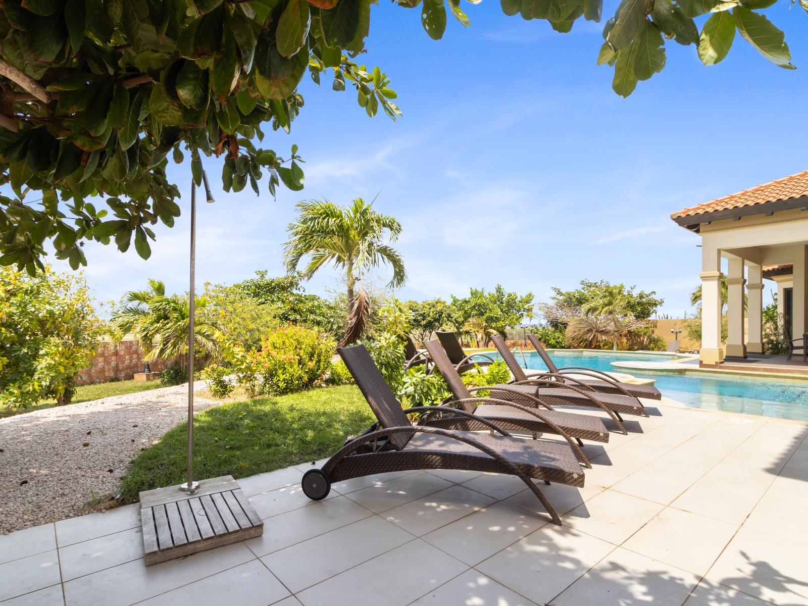 Unwind in ultimate comfort on our poolside lounge chairs, the perfect spot for soaking up the sun's warmth.