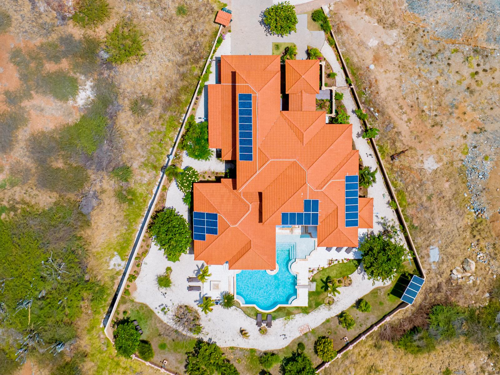 Behold the breathtaking beauty of our villa from a bird's-eye view, a captivating oasis nestled in nature.