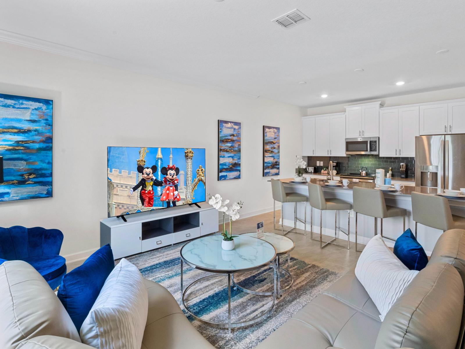 Living room with large smart TV and breakfast bar