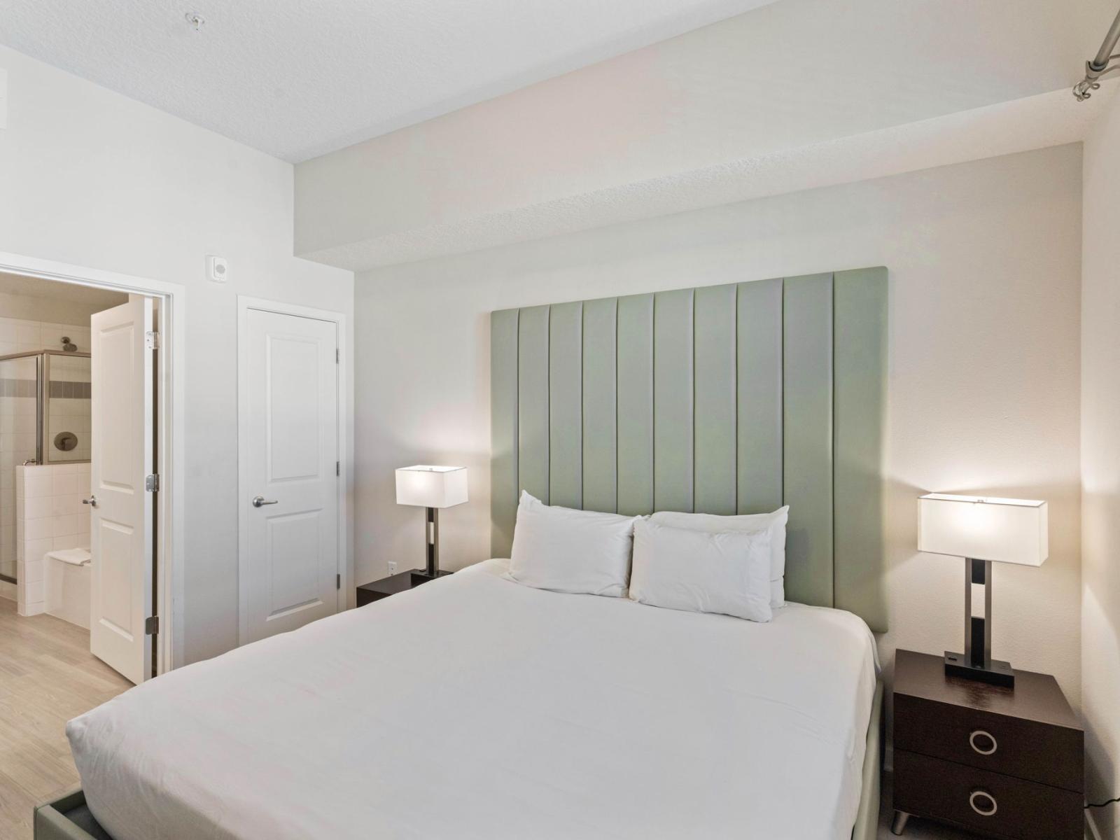 Serene Sanctuary: The main bedroom offers a peaceful retreat with its elegant decor and inviting ambiance, perfect for restful nights and lazy mornings."