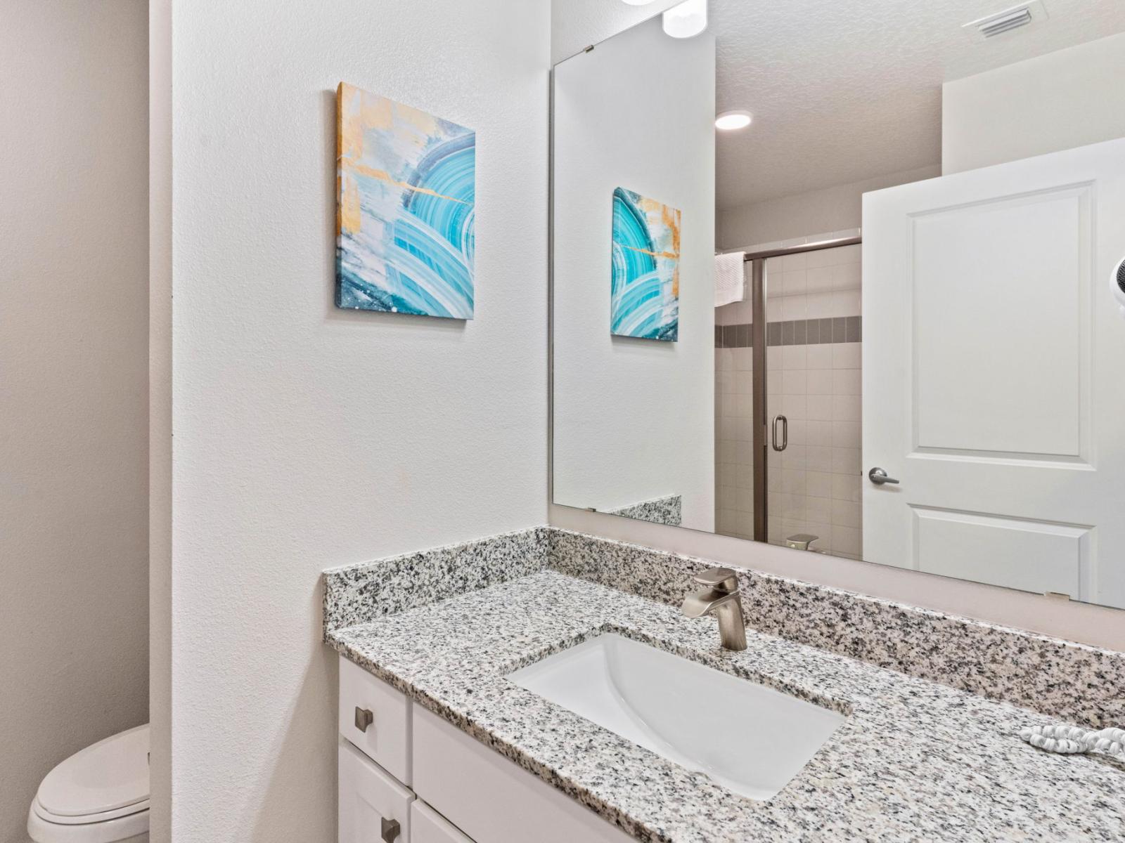 Private Comfort: Step into the ensuite bathroom of Bedroom 2, offering convenience and privacy with its well-appointed features.