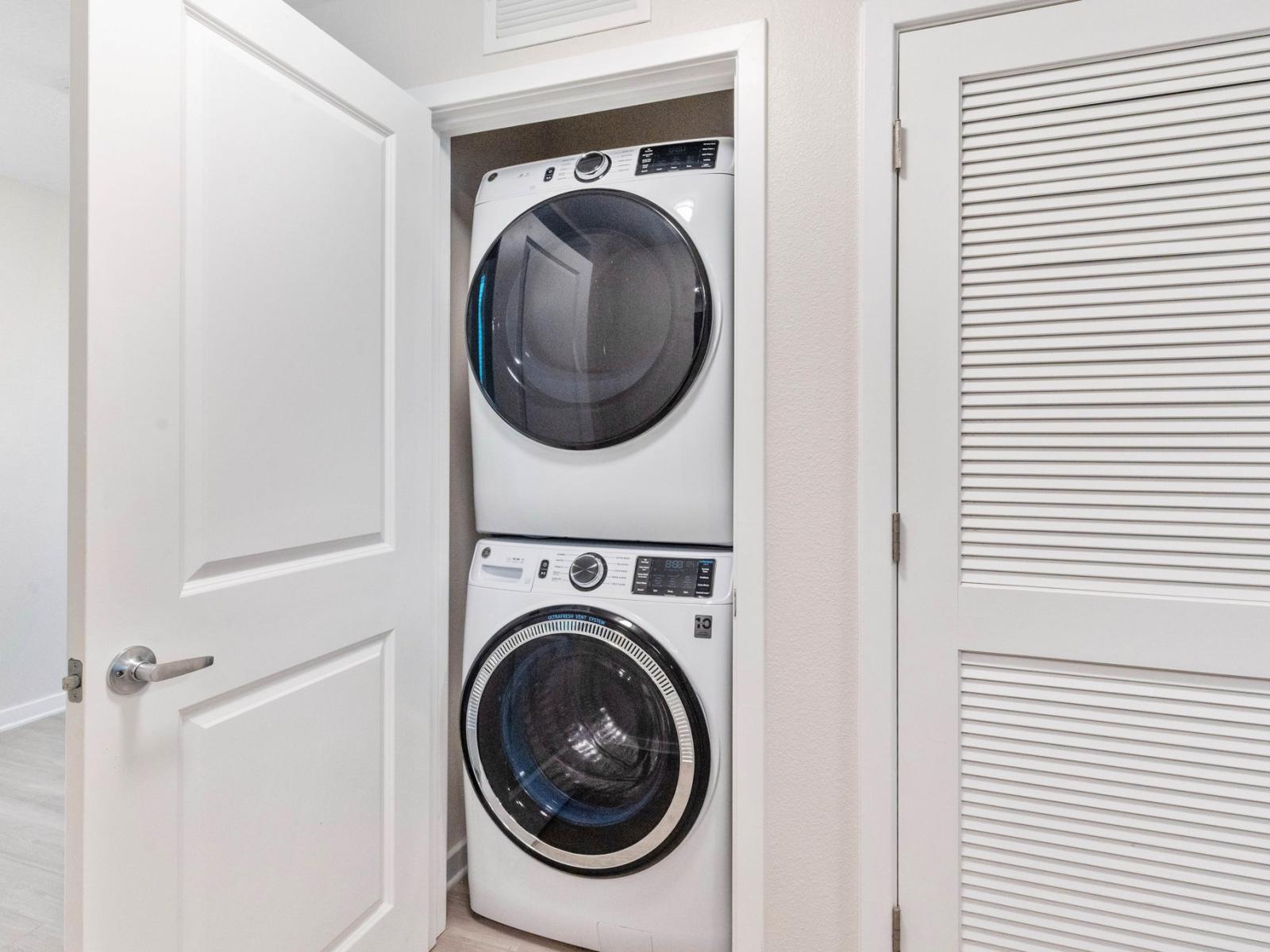 Streamline your laundry routine with our neatly arranged laundry area. Discover the convenience of our minimalist yet efficient laundry space.