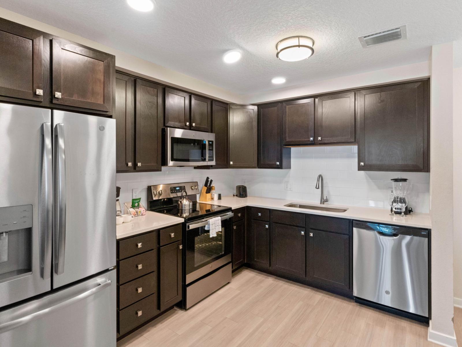 Modern Kitchen of the condo at Vista Cay Resort - Fully equipped with all kitchen accessories - Guests can indulge their culinary passions and create delicious meals - Amidst sleek design and contemporary amenities with plenty storage space