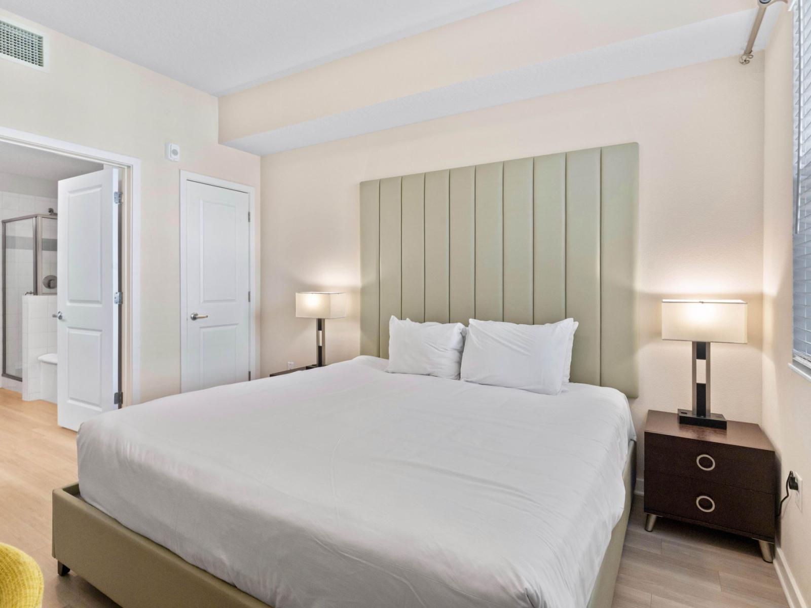 Spacious Bedroom of the condo where comfort meets elegance at the Vista Cay Resort - With Cozy double bed providing guests with a serene retreat for restful nights - Majestically decored bedroom with beautiful wall paintings - Bedside bright window