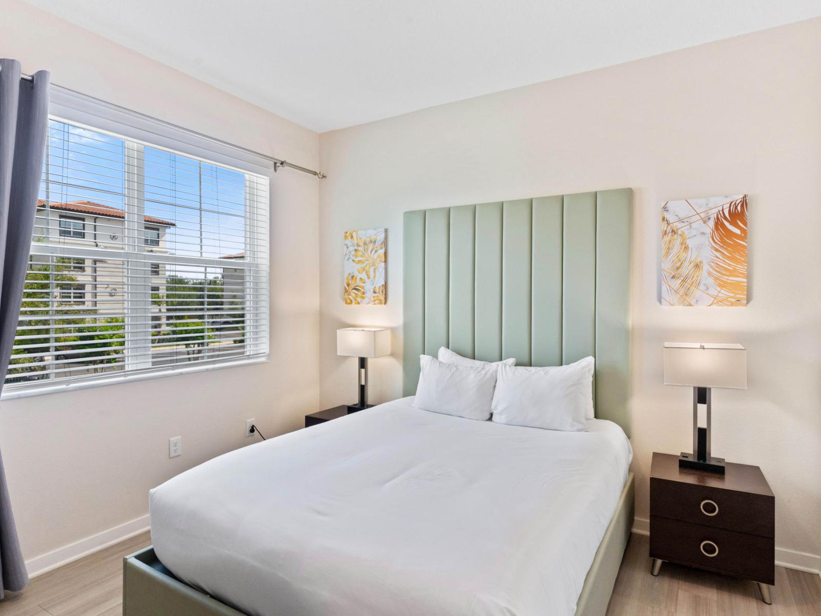 Spacious Bedroom of the condo where comfort meets elegance at the Vista Cay Resort - With Cozy double bed providing guests with a serene retreat for restful nights - Majestically decored bedroom with beautiful wall paintings - Bedside bright window