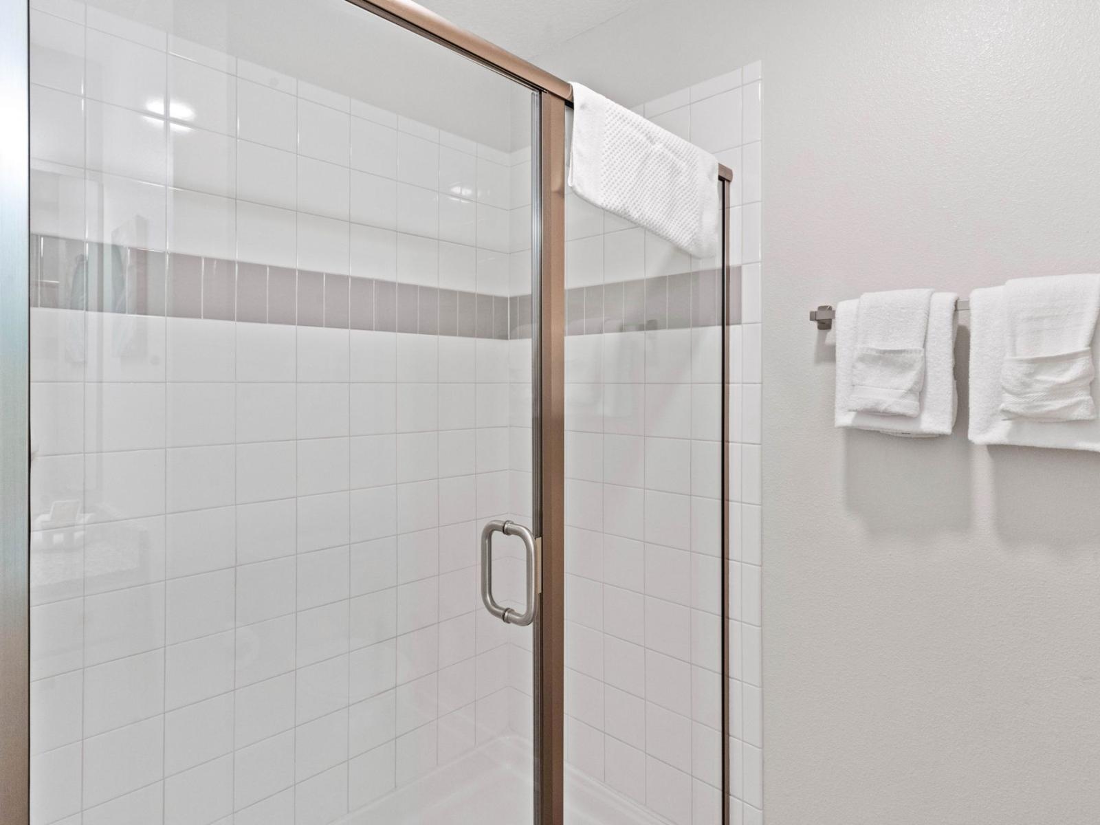 Elegant Bathroom of the Condo in Vista Cay Resort - Chic Vanity with large mirror - Experience Pure Comfort - Featuring a Spacious Walk-In Shower