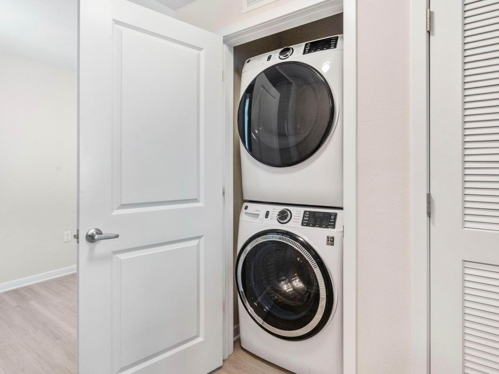 The laundry room of the condo at Vista Cay Resort - Boasts a full washer and dryer setup - Providing guests with the ultimate convenience to refresh their wardrobe and maintain their vacation rhythm effortlessly.