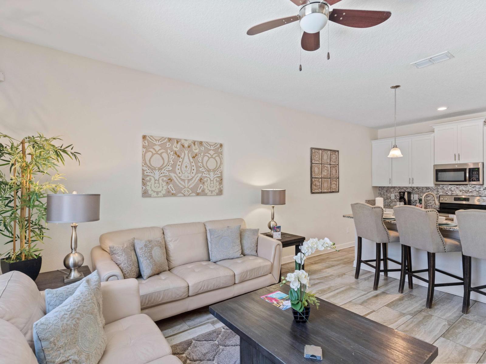 Stunning living area of the town house in Kissimmee Florida - The living room Is the perfect place to gather and share stories after a day of exploration - Cozy seating area conducive to relaxation and socializing