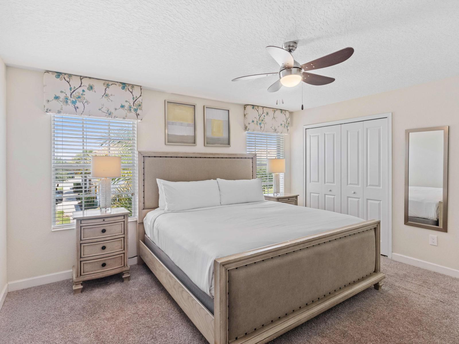 Deluxe bedroom of the town house in Kissimmee Florida - Cozy retreat with a plush bed, perfect for relaxation - Thoughtfully designed bedroom featuring functional and stylish furniture - Full length mirror