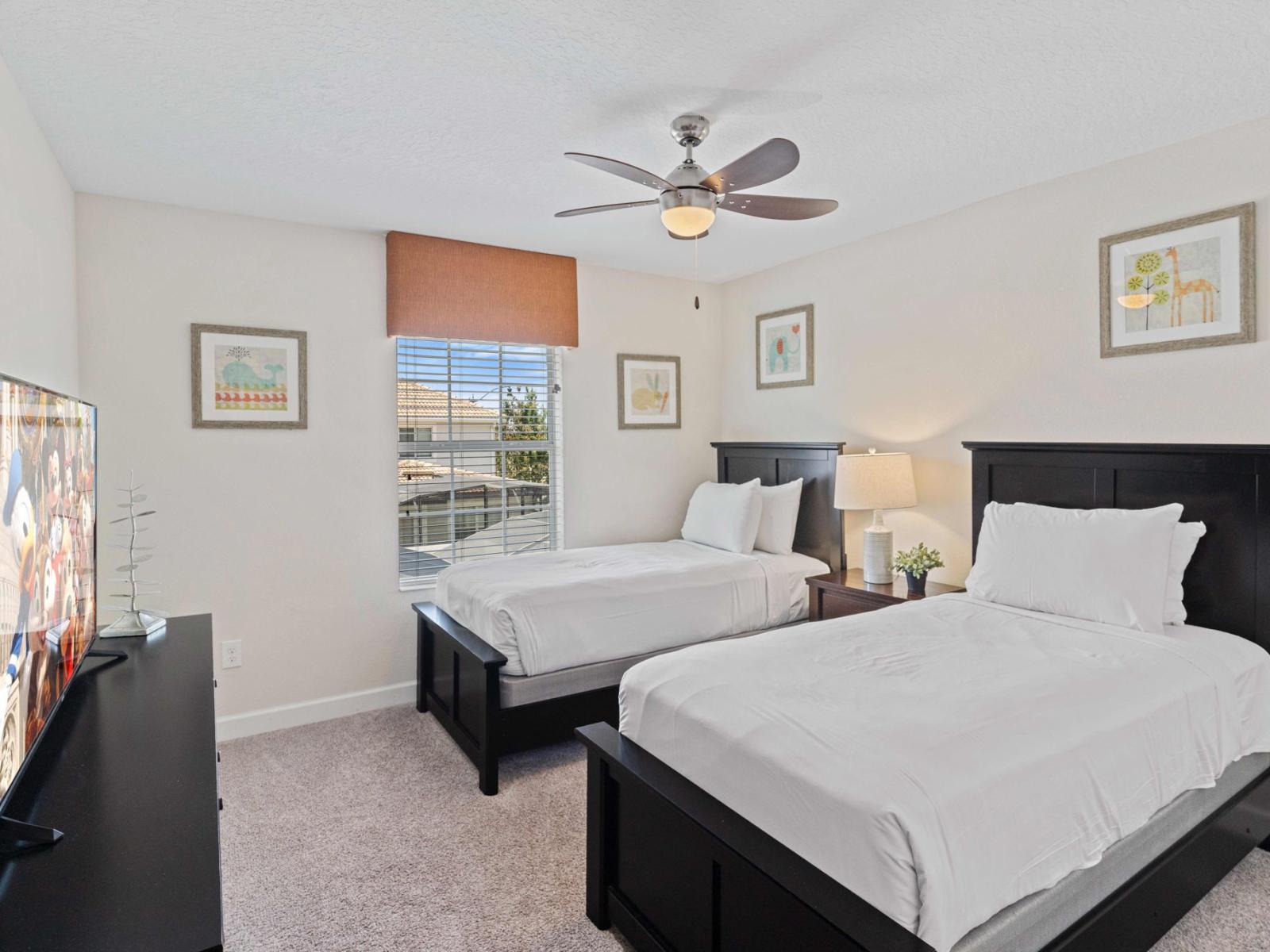 Chic bedroom of the town house in Kissimmee Florida - Two single bed for relaxation - Modern and stylish decor that complements the space - Tranquil bedroom retreat for restful nights