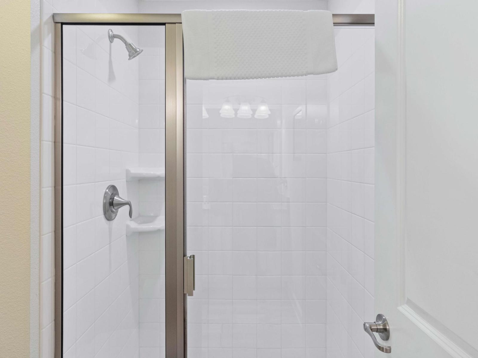 Bathroom with tiled walk-in shower area for you to refresh and recharge