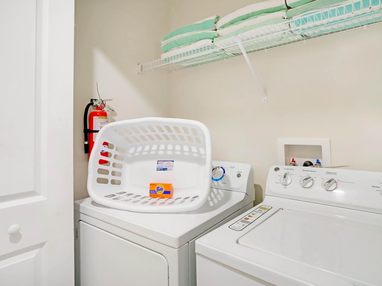 Laundry room with full washer and dryer of the town house in Kissimmee Florida - Equipped with a washer and dryer - Chores become a breeze amidst convenience and comfort