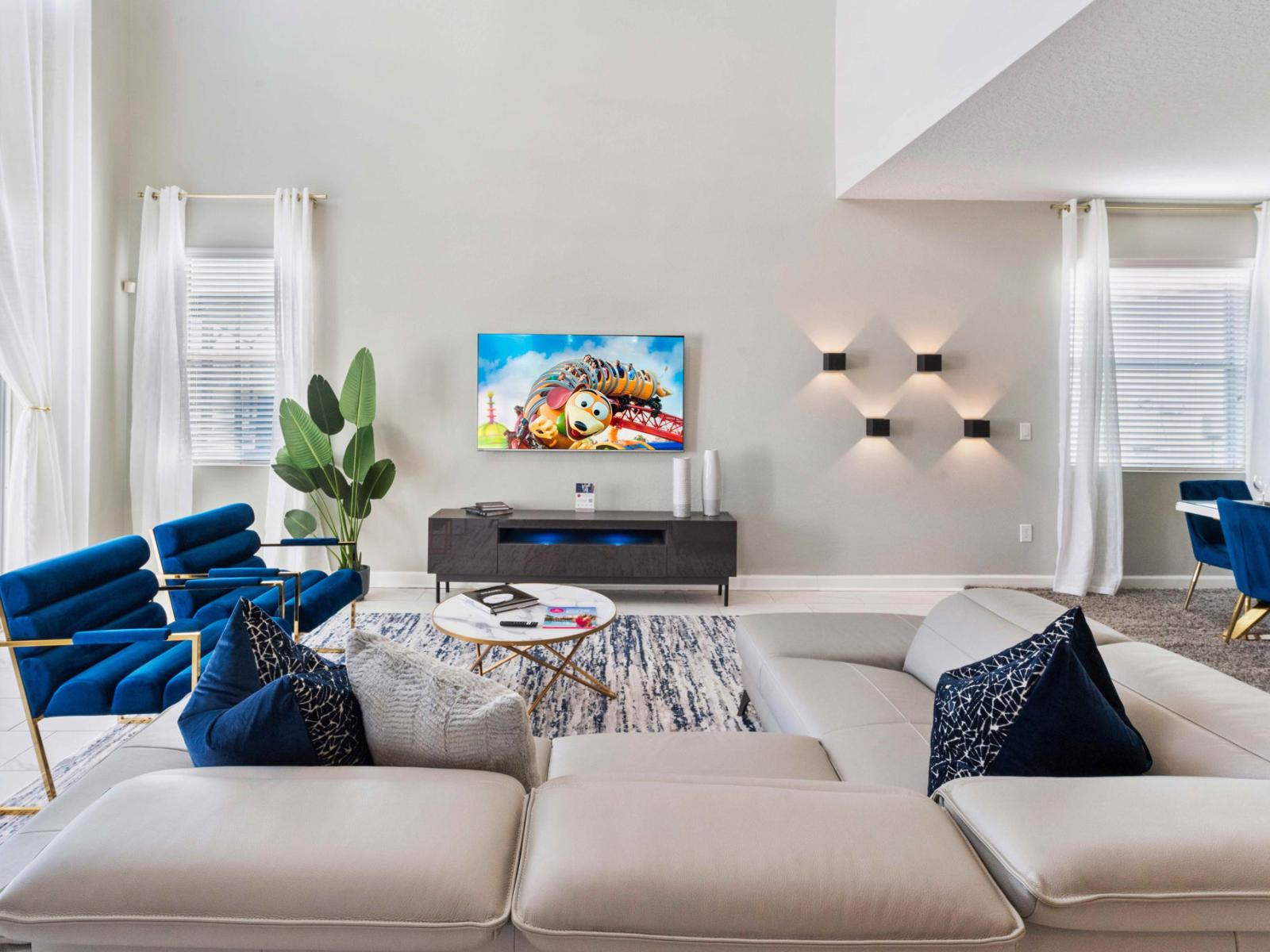 The  living area boasts a sleek smart TV, inviting you to unwind in style. From cozy movie nights to catching up on your favorite shows, this space offers the perfect blend of comfort and entertainment for unforgettable moments with loved ones.