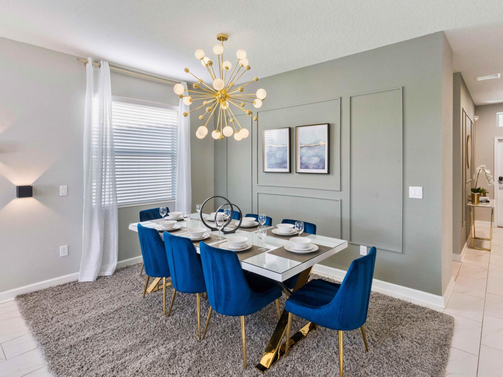 Elegant dining area of the home in Kissimmee Florida - 8 Persons dining - Chic dining area featuring a stylish table and contemporary seating - Sophisticated design with a blend of modern and classic elements