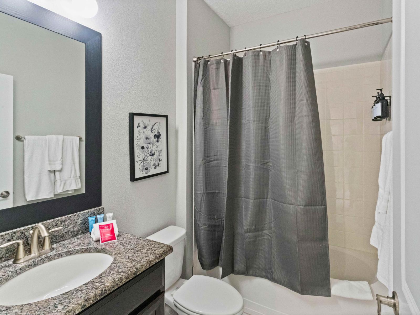 1st bathroom with bathtub and shower combo