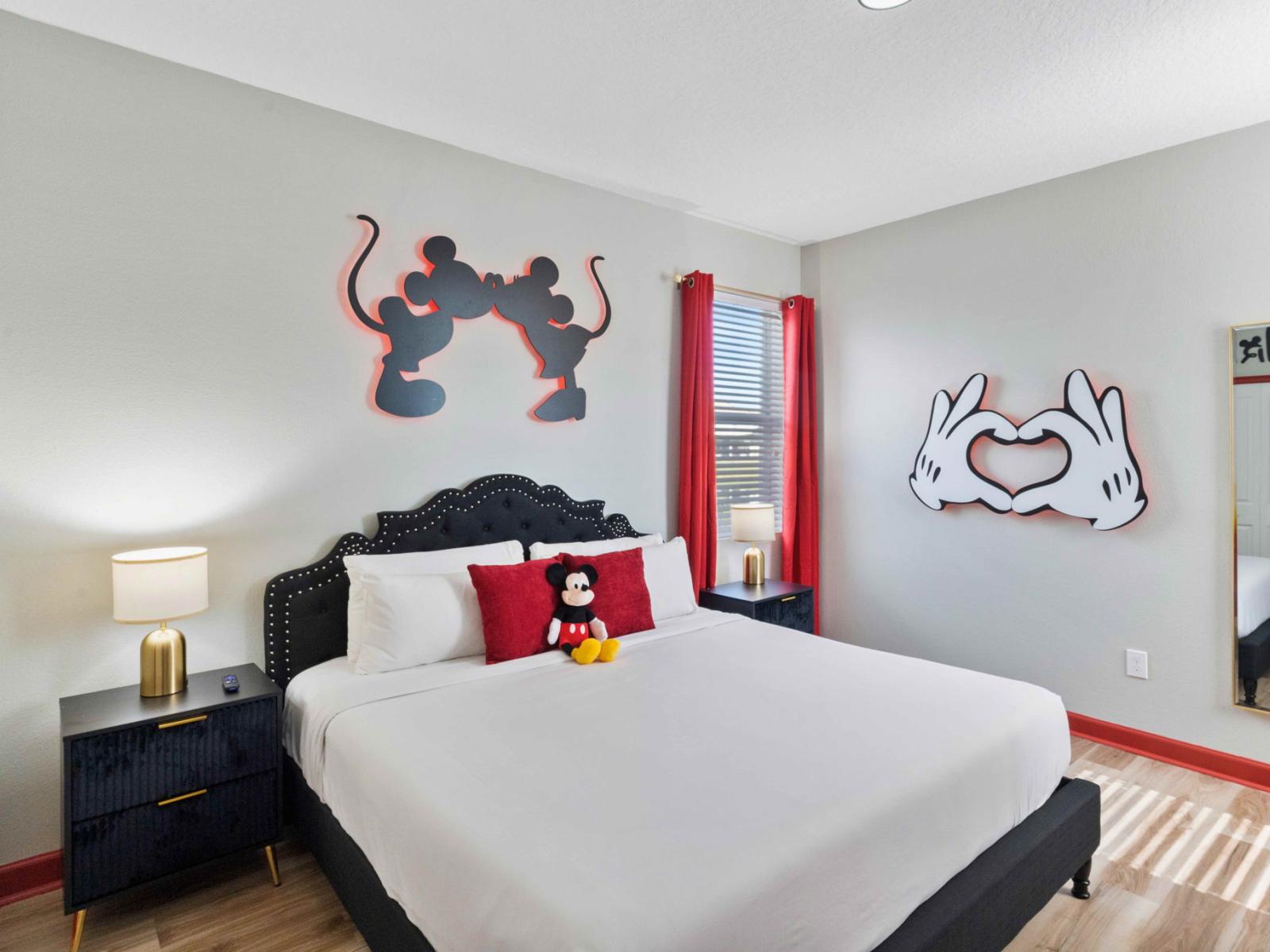 Mickey and Minnie themed bedroom of the home in Kissimmee Florida - With king size bed and smart TV - Make your dreams come true in our delightful Mickey Mouse inspired bedroom - Modern and stylish decor that complements the space