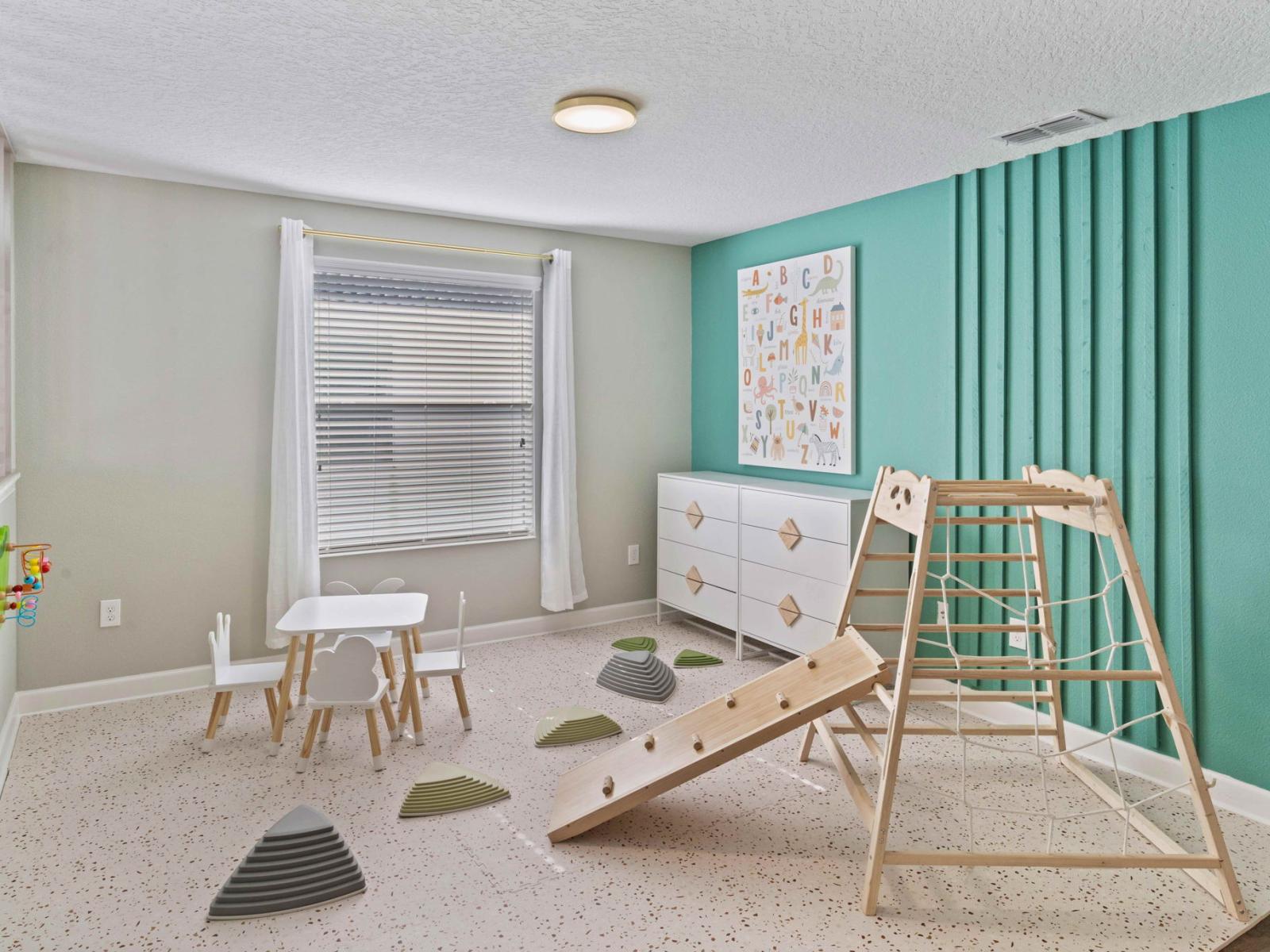 Play room of the home in Kissimmee Florida - Playground for kids 6 months up to 5 years - Transform playtime into precious moments of discovery and laughter - Thoughtfully designed playground for toddlers and young children