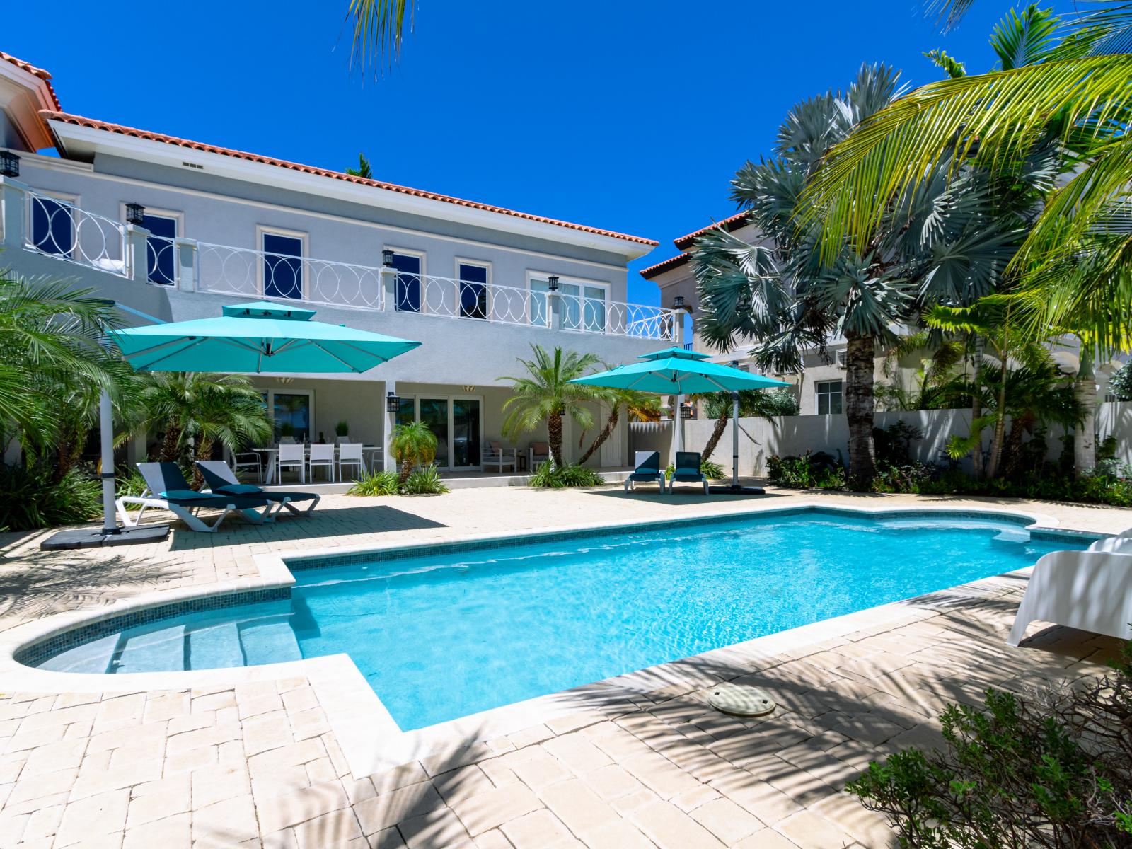 Splendid Private Pool of the villa in Noord Aruba - Cosy beach chairs available - Dive into refreshing poolside escape - Immerse yourself in the cool elegance of our pool - Experience ultimate relaxation in our poolside paradise