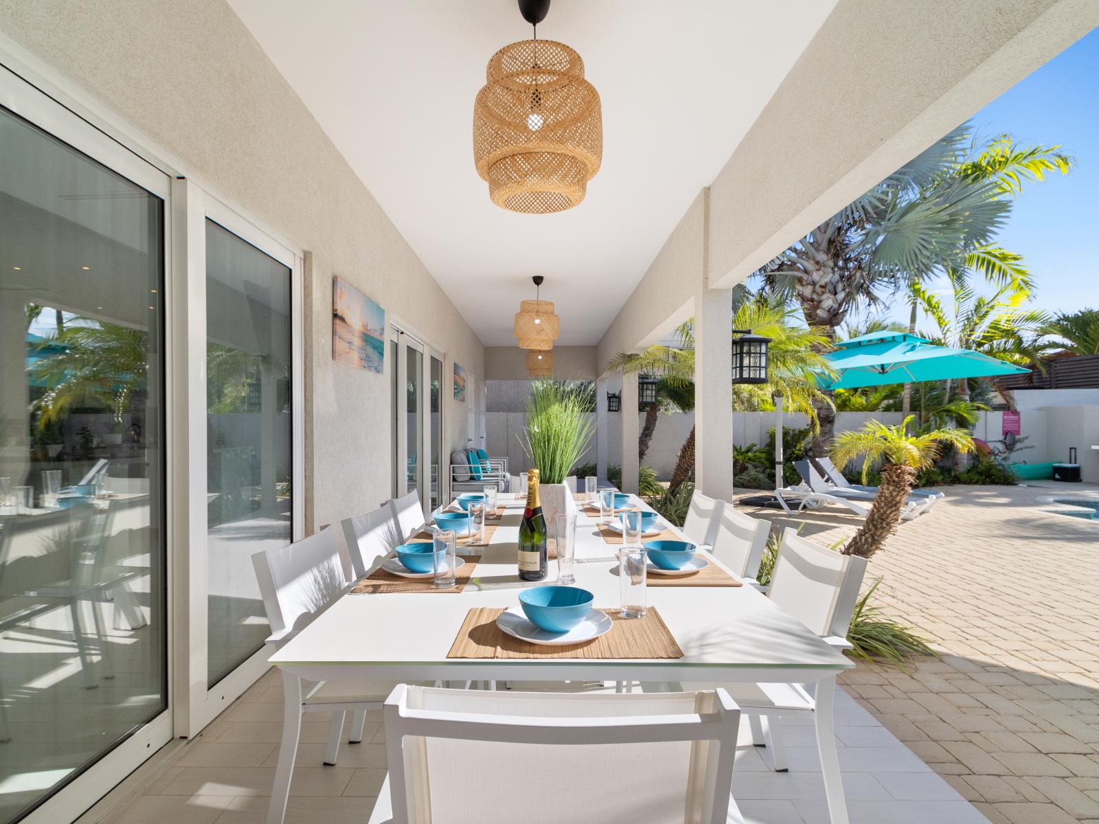 Elite outdoor dinning area of the villa in Aruba - Beautiful pool facing outdoor dinning area of the villa - Elite 8 persons dinning - Mesmerizing pool views - Majestic decored space - Refreshing Environment - Imposing chandeliers