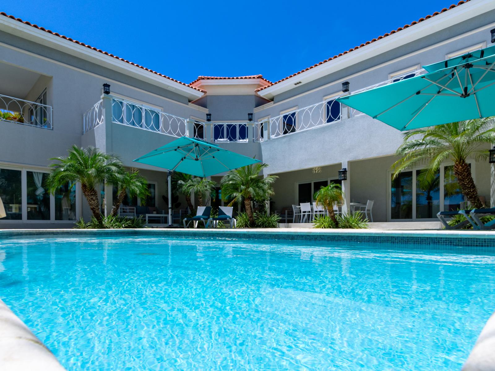 The pool is meticulously serviced and maintained to ensure it's always in pristine condition.