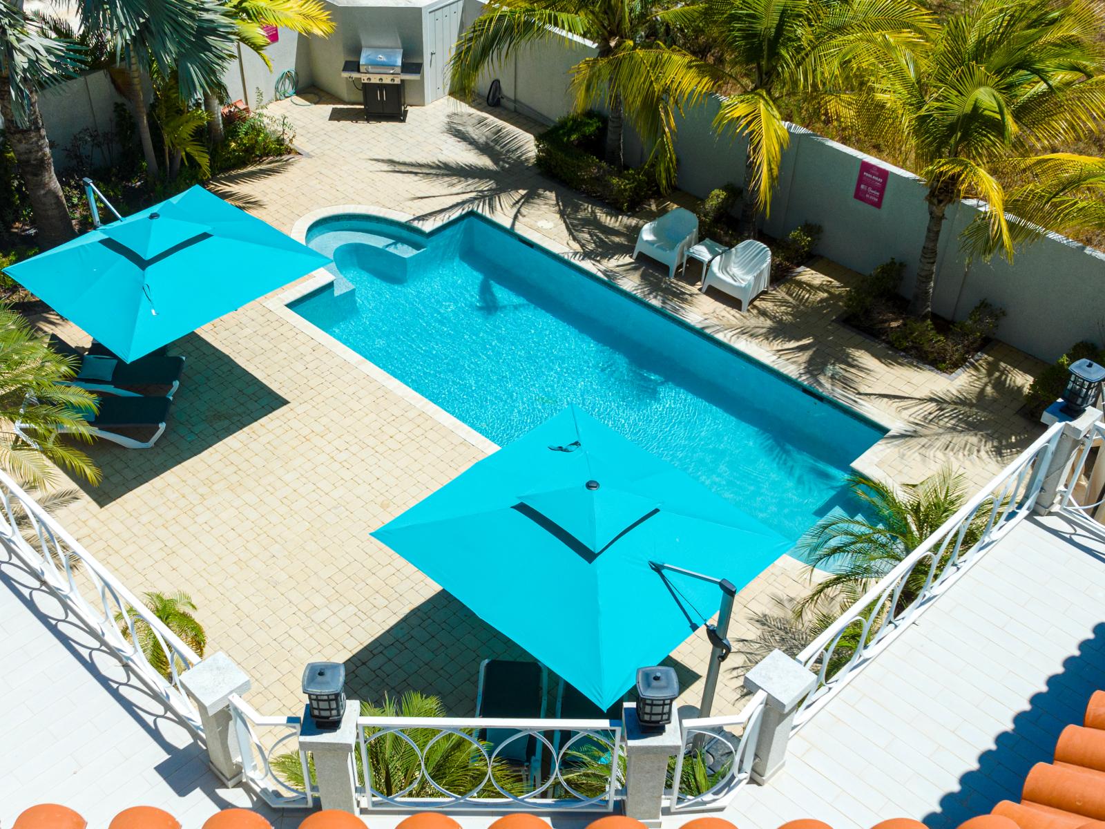 Enjoy the beauty of our backyard pool area, perfect for relaxation and leisure.