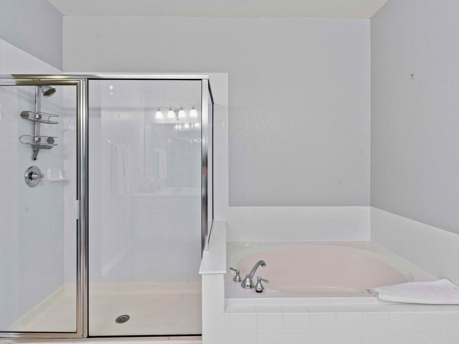 Main bathroom with shower and bathtub  What could be better than a warm, comforting shower in this neat and clean bathroom.