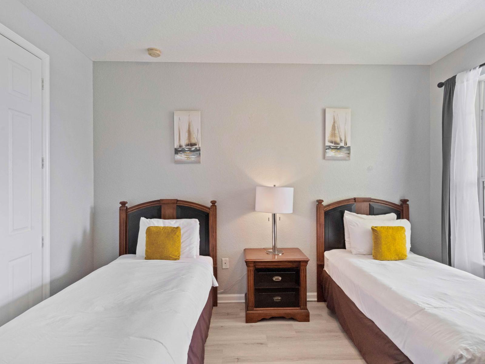 Ideal for kids or guests, the second bedroom includes two comfortable single beds.