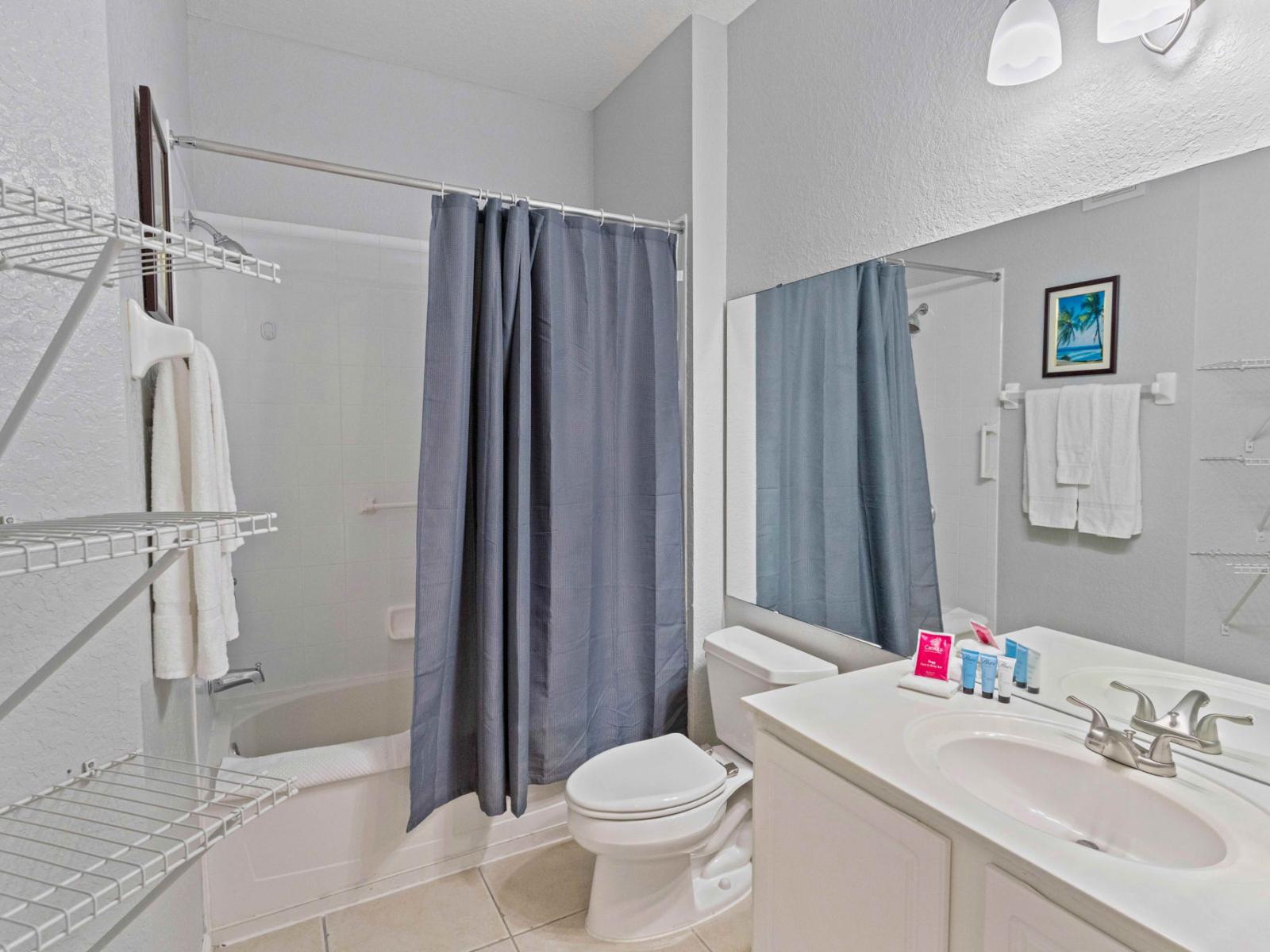 2nd bathroom with bathtub and shower combo  What could be better than a warm, comforting shower in this bathroom with bathtub and shower combo.