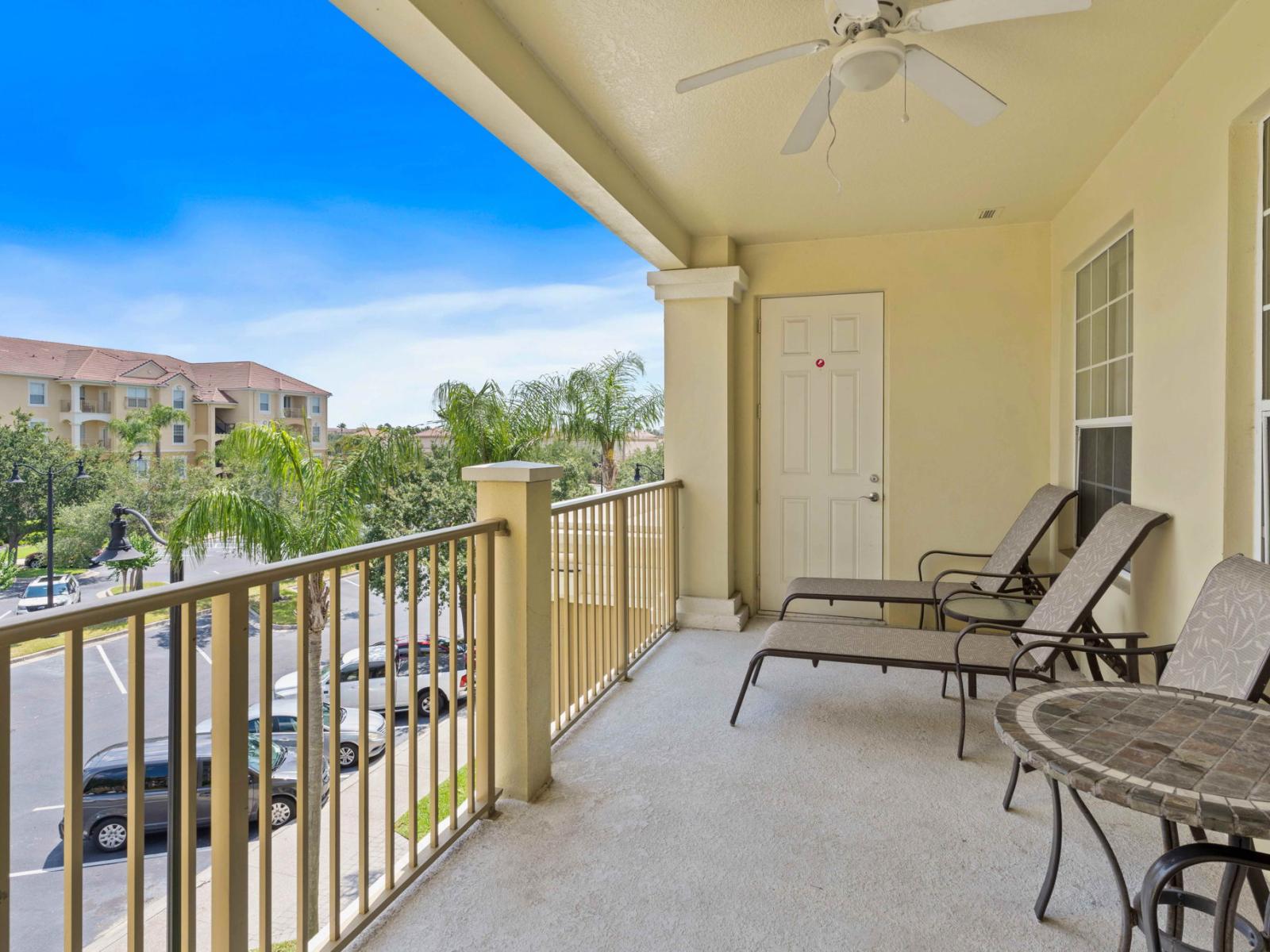 Balcony with lounge chairs  Sit back and relax while enjoying the view of the city in this private balcony.