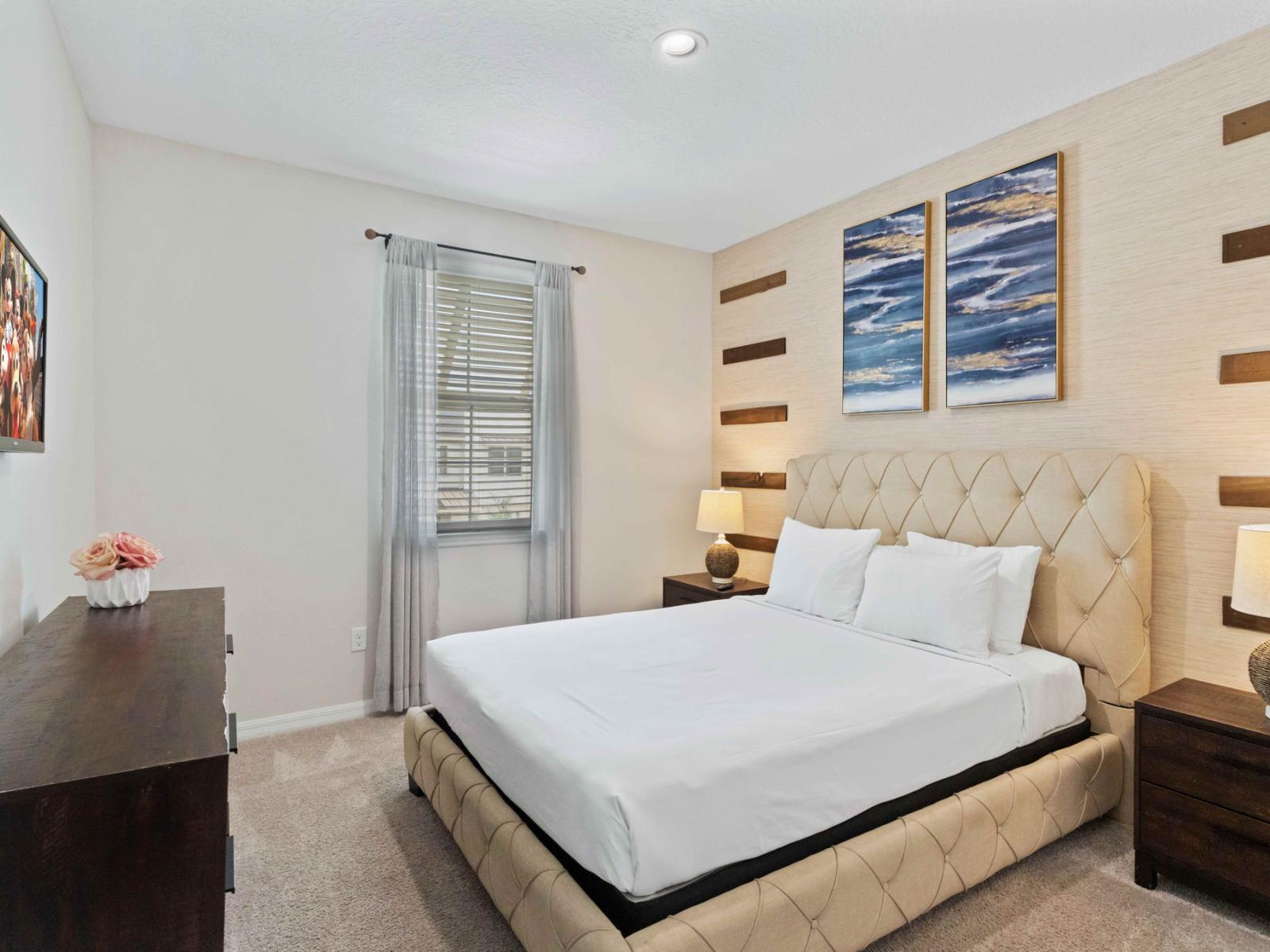 Chic bedroom of the home in Kissimmee Florida - Indulge in the elegance of this retreat - Featuring a plush bed for a cozy and stylish getaway - Smart TV and Netflix - Elegant decor