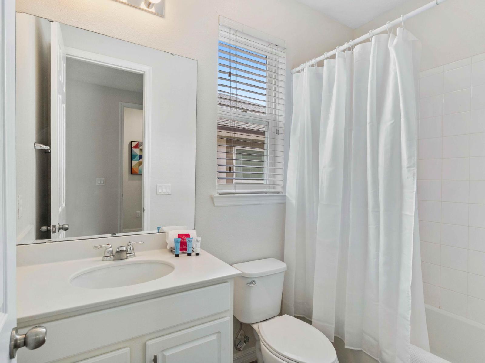 Bathtub Bliss: Rejuvenate in our ensuite bathroom, where a deep soaking bathtub and a sleek walk-in shower provide the perfect balance of indulgence and convenience