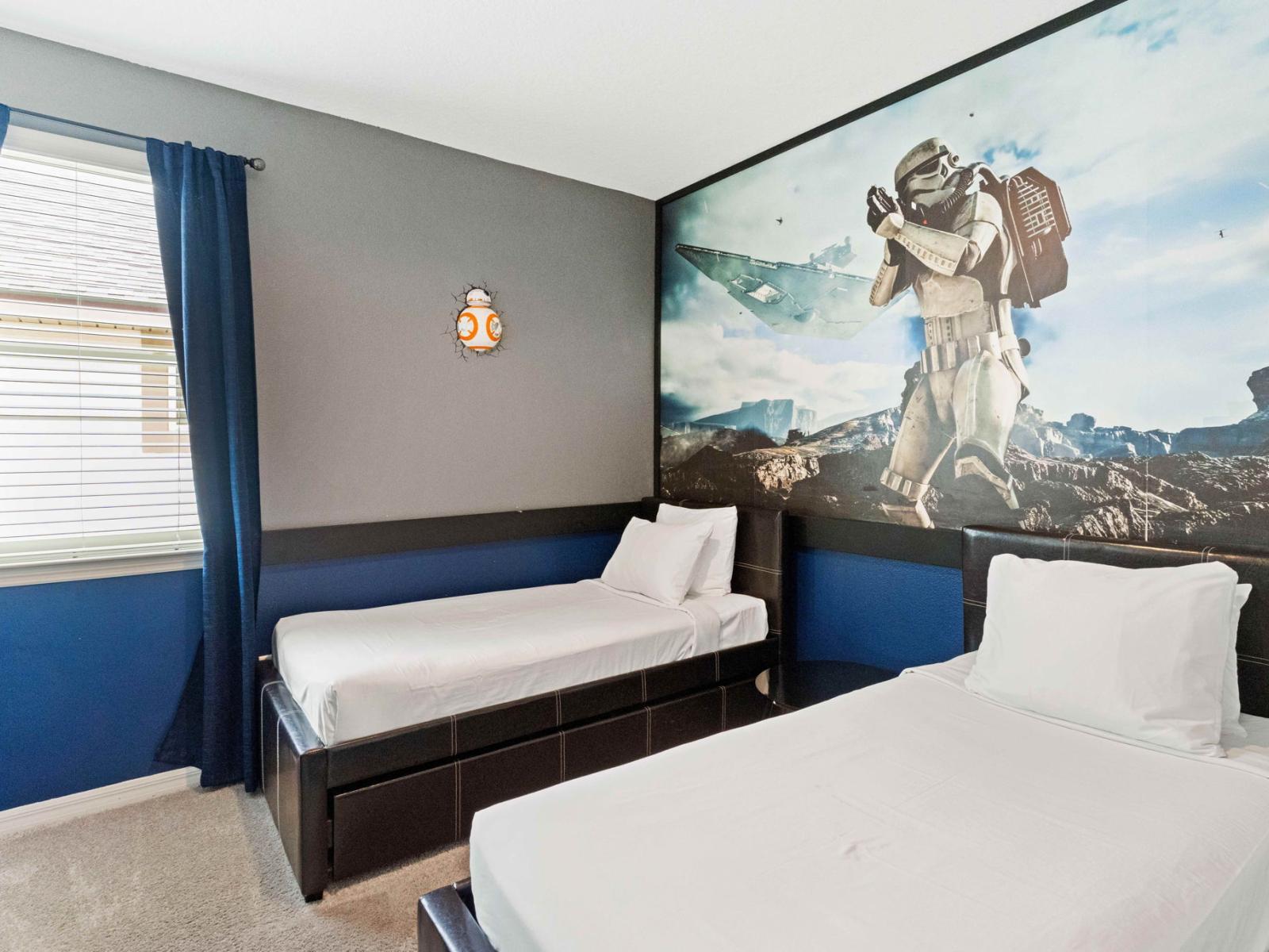 Star Wars themed bedroom of the home in Kissimmee Florida - Experience the perfect blend of comfort and companionship - Inviting bedroom with two single beds - Plush bedding and pillows for a luxurious feel