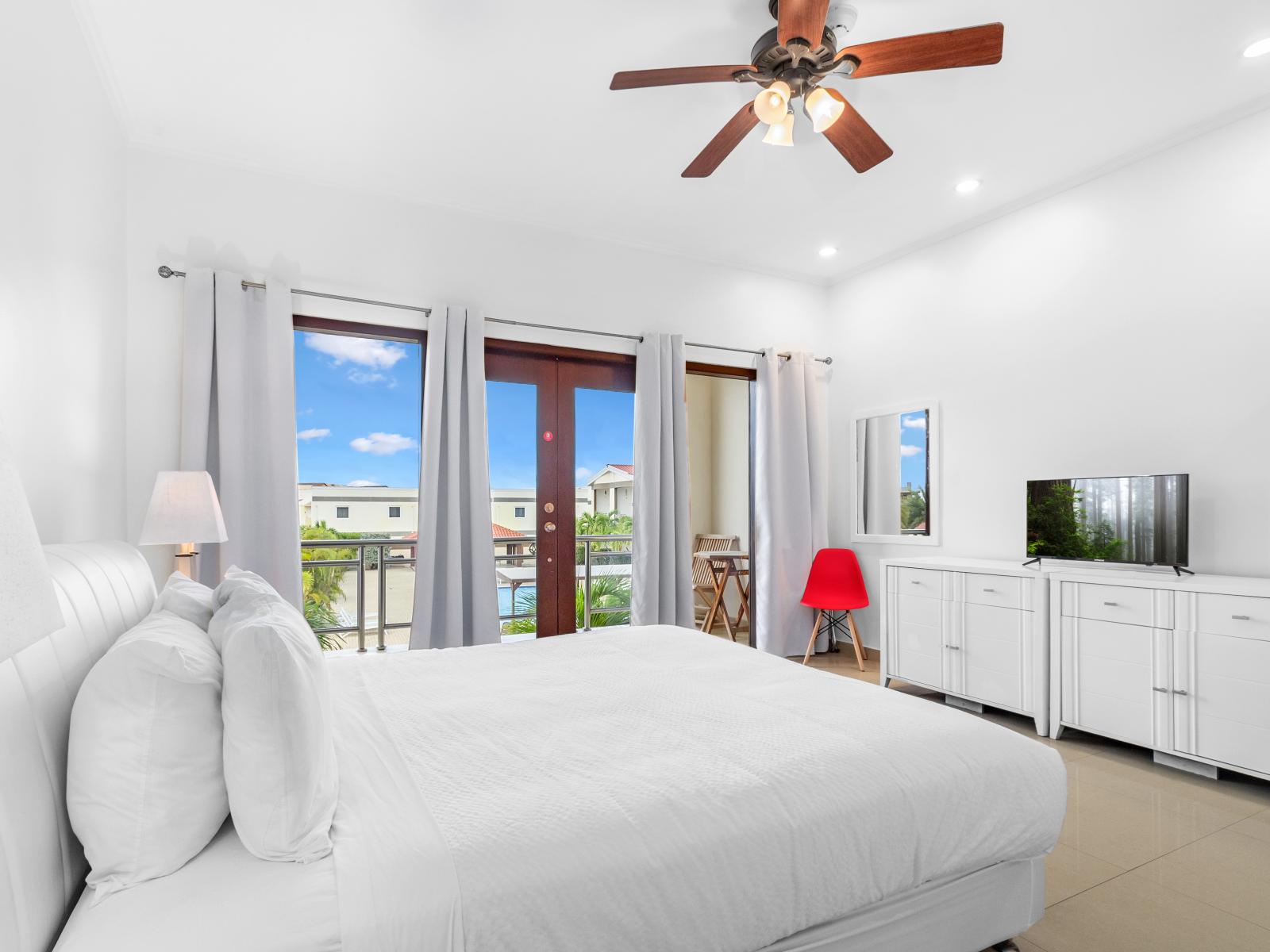 Premium Bedroom of the 2BR Condo in Noord Aruba - Indulge in regal relaxation - Minimalistic Approach giving clean space to relax - Smart TV and Netflix - Bedroom boasts a king bed