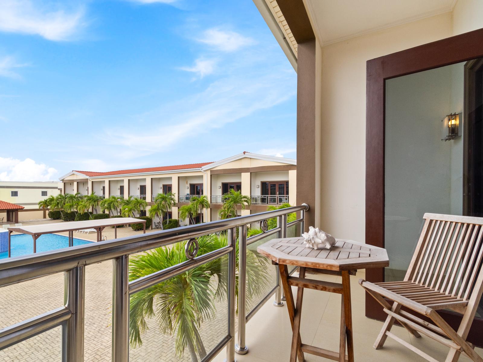 Private balcony of the 2BR Condo in Noord Aruba - Fronting the pool you would have a lovely view  - breath of fresh air from the outside - Peaceful Environment