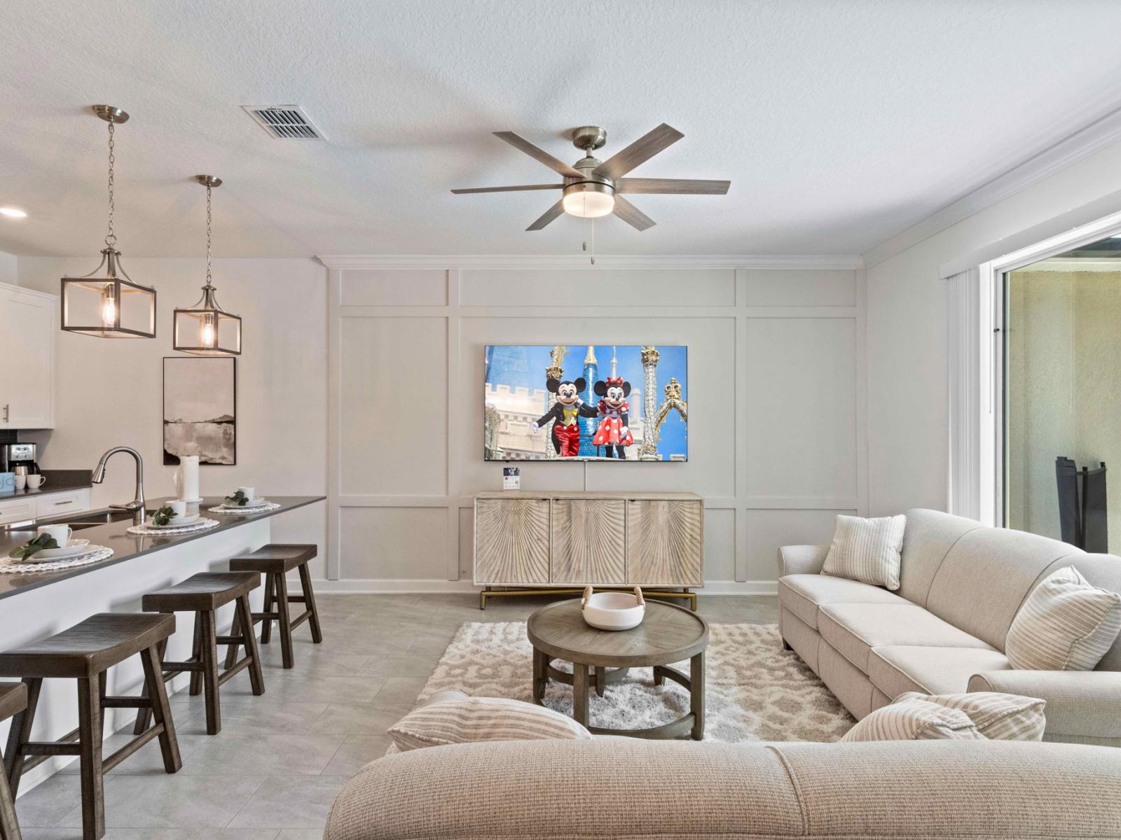 Captivating living area of the townhouse in Kissimmee Florida - Harmonious blend of textures and materials - Cozy seating area conducive to relaxation and socializing - Harmonious color scheme with pops of accent colors for visual interest