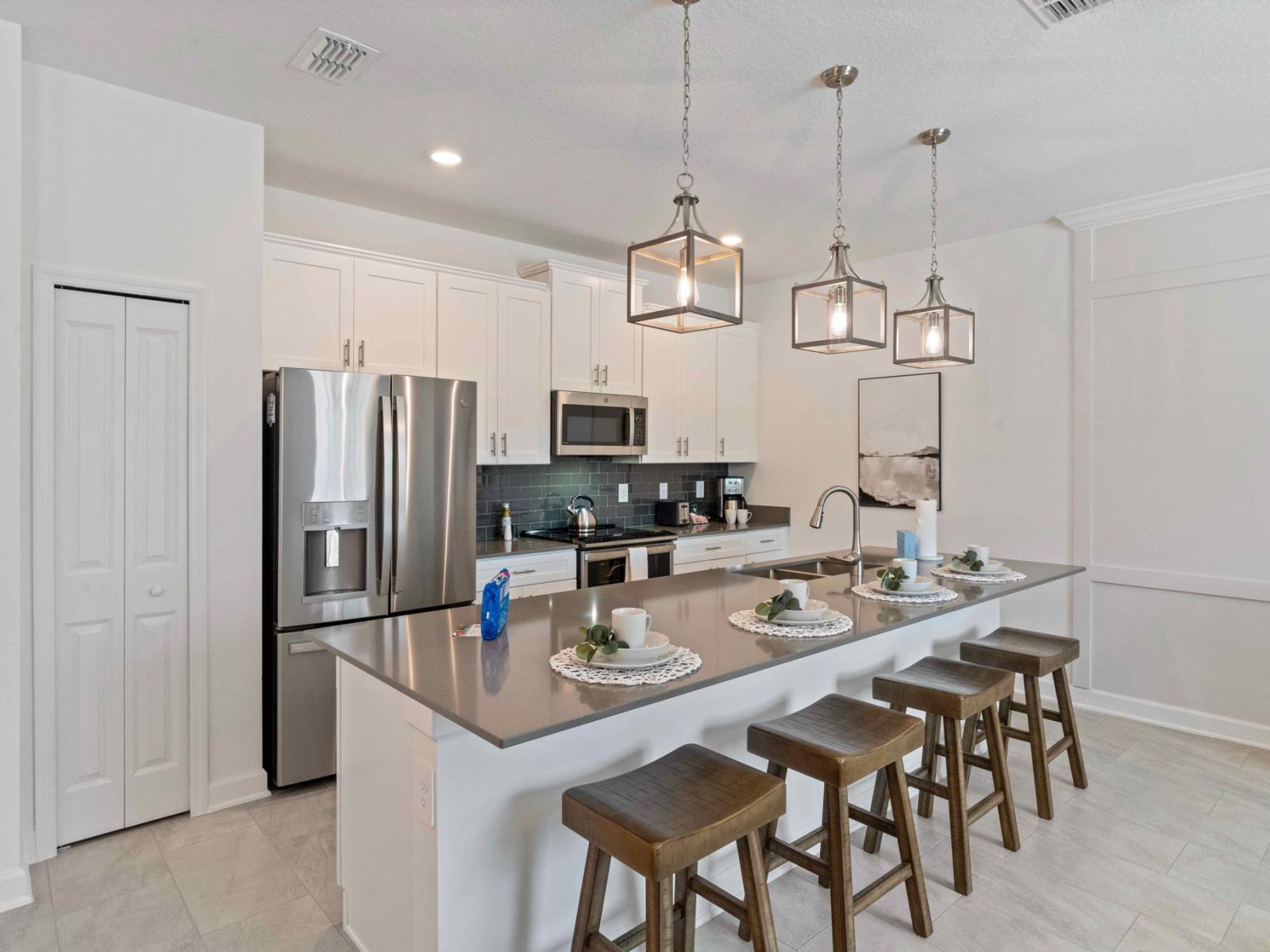 Modern Kitchen of the townhouse in Kissimmee Florida - A spacious layout that's perfect for meal preparation and entertaining - Plenty of cabinet space and storage for all your culinary needs - Stainless steel appliance