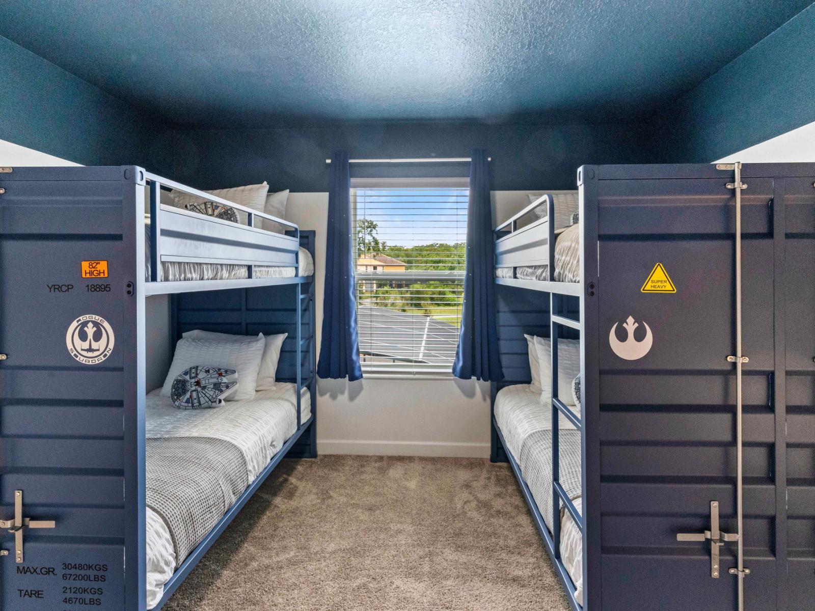 The fourth bedroom offers four single bunk beds and a smart TV, ideal for a fun and comfortable stay.